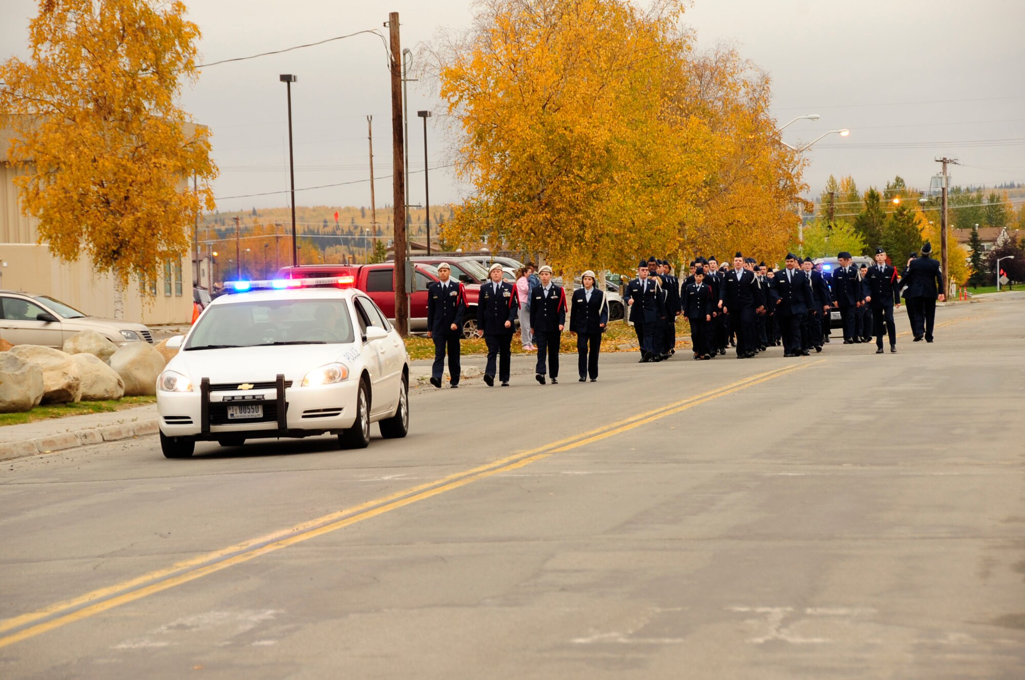 Cadets of the Ben Eielson Junior Reserve Officer Training Corps march from Ben Eielson High School to Amber Hall Sept. 11 to perform a reveille ceremony. Ben Eielson JROTC cadets perform an annual reveille ceremony, this one highlighting the anniversary of the Sept. 11 attack on the U.S.  (U.S. Air Force photo/Staff Sgt. Tia Schroeder)