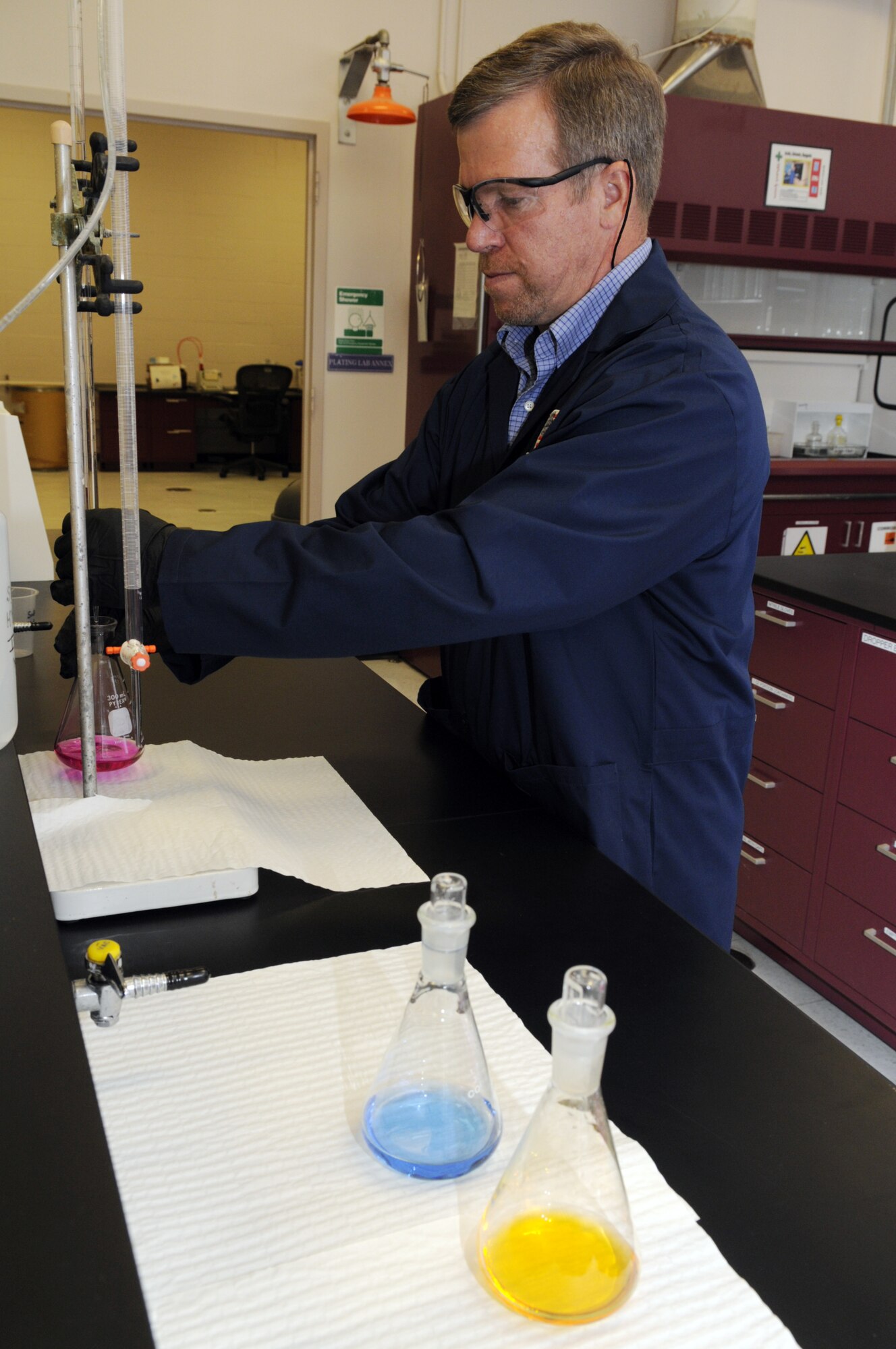 Steve Rollyson, chemist performs analysis of metal finishing solutions in support of the Center plating shop. U. S. Air Force photo by Sue Sapp