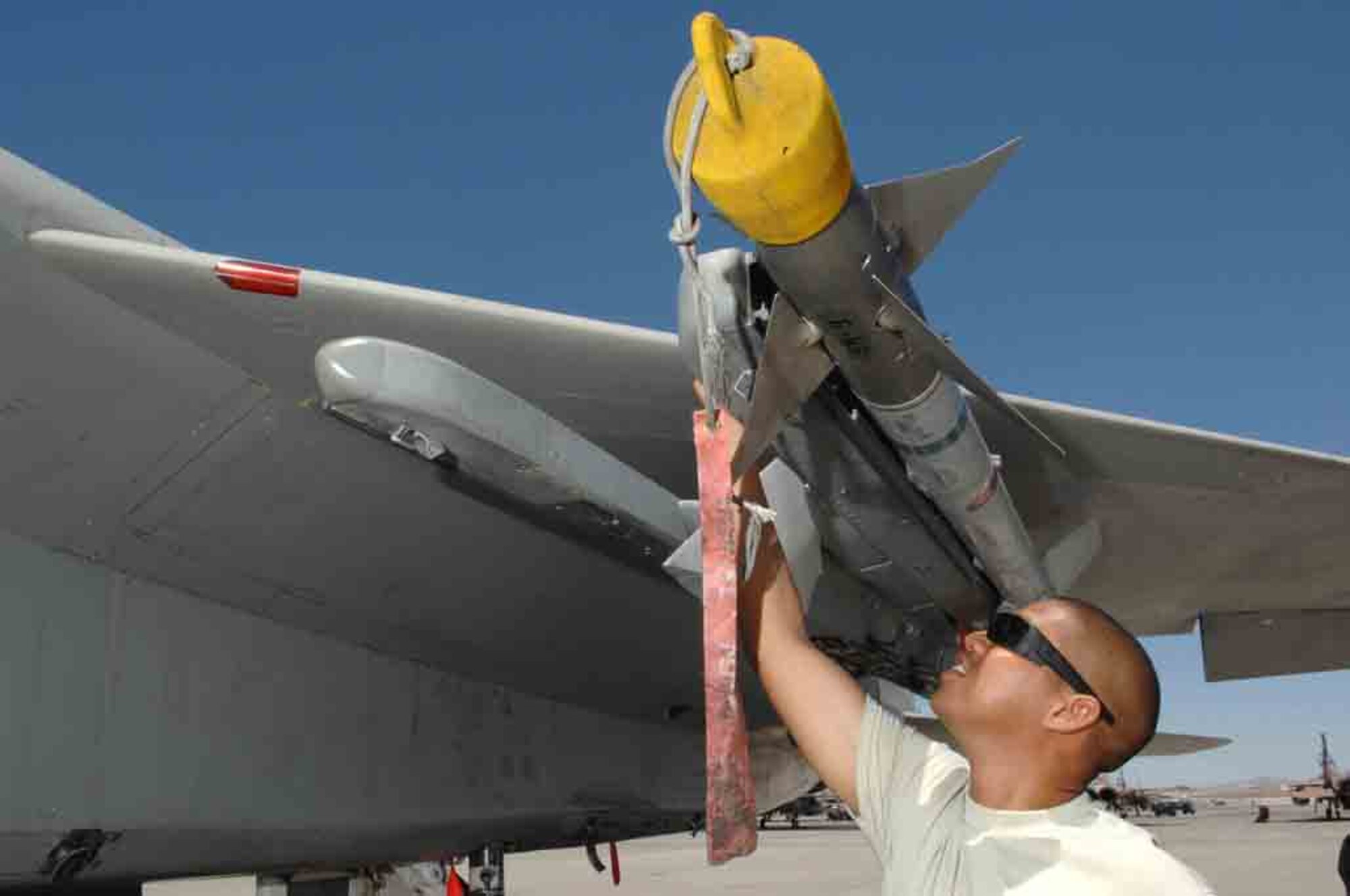 Tech Sgt. John Robles, an F-15 weapons expediter assigned to the 926th Group Detachment 2, performs a supervisory post-load inspection of an AIM-9 missile July 24, 2008 at Nellis Air Force Base, Nev. The 926th Group is an Air Force Reserve unit under 10th Air Force, Naval Air Station Joint Reserve Base, Fort Worth, Texas. The group is located at Nellis AFB as an associate unit to the United States Air Force Warfare Center. Through Total Force Integration, reservists are integrated into regular Air Force units, accomplishing the USAFWC's mission alongside REGAF personnel on a daily basis.
(U.S. Air Force Photo/Senior Airman Larry E. Reid Jr., Released)
