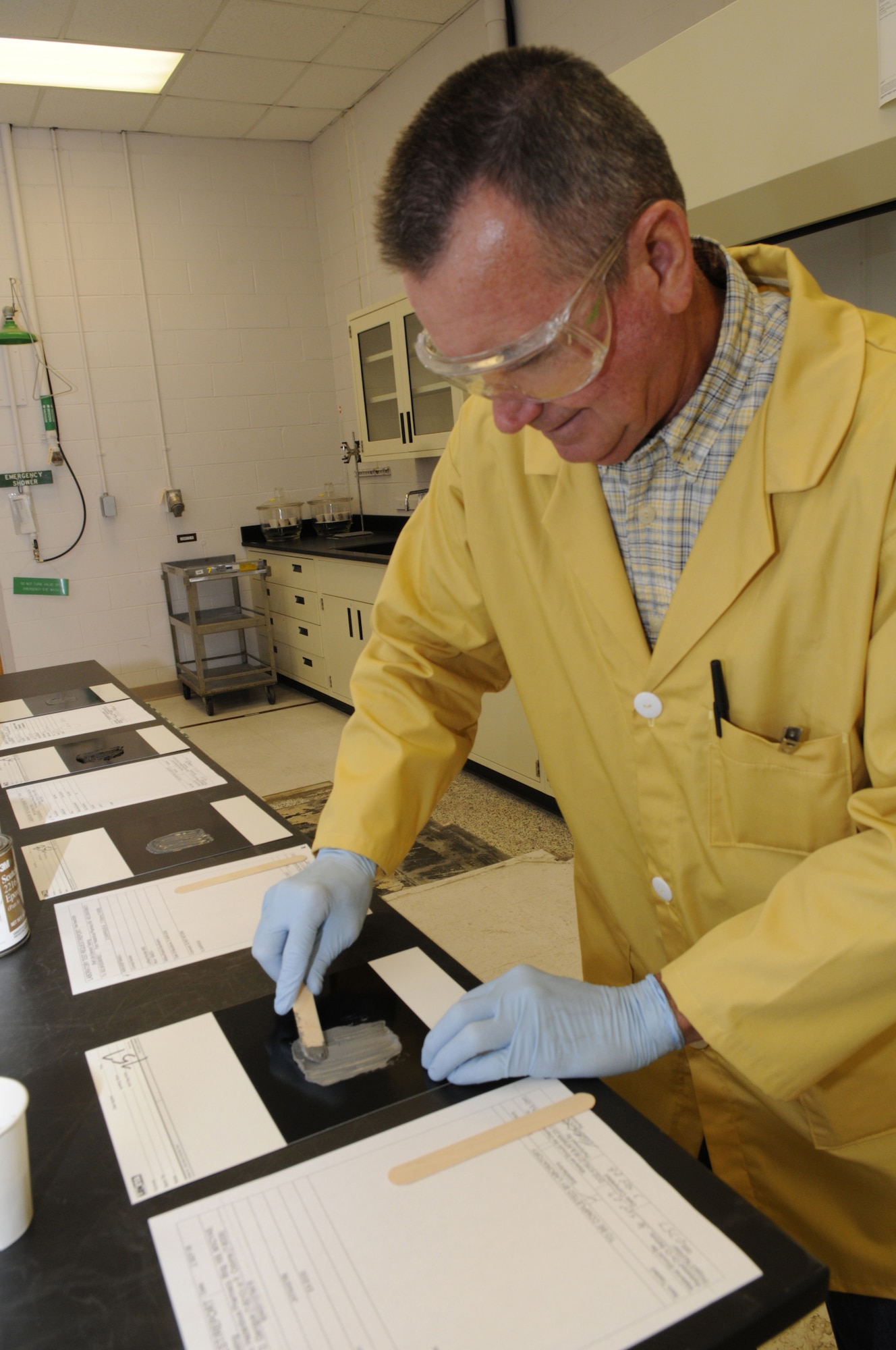 Mike Butts, chemist, performs cure testing to determine if a product is still usable. The cure time can vary from 30 minutes to 22 days.The shelf life testing has saved $1.1 million in product replacement costs. U. S. Air Force photo by Sue Sapp