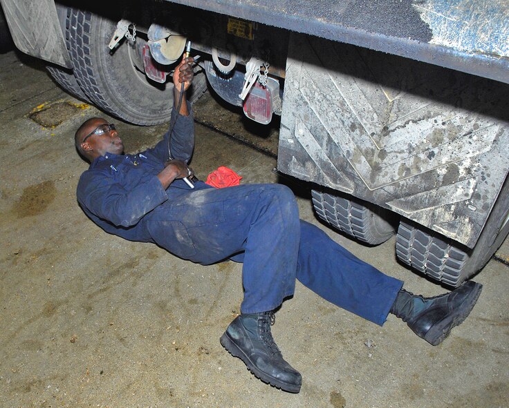 MINOT AIR FORCE BASE, N.D. -- Staff Sgt. John Bishop, 5th Logistics Readiness Squadron vehicle maintenance craftsman, rebuilds part of a dump truck here Sept. 17 in preparation for the upcoming winter months. Heavy-duty hauling is one of the many mission-essential capabilities the 5th LRS provides Minot AFB. (U.S. Air Force photo by Airman 1st Class Benjamin Stratton)
