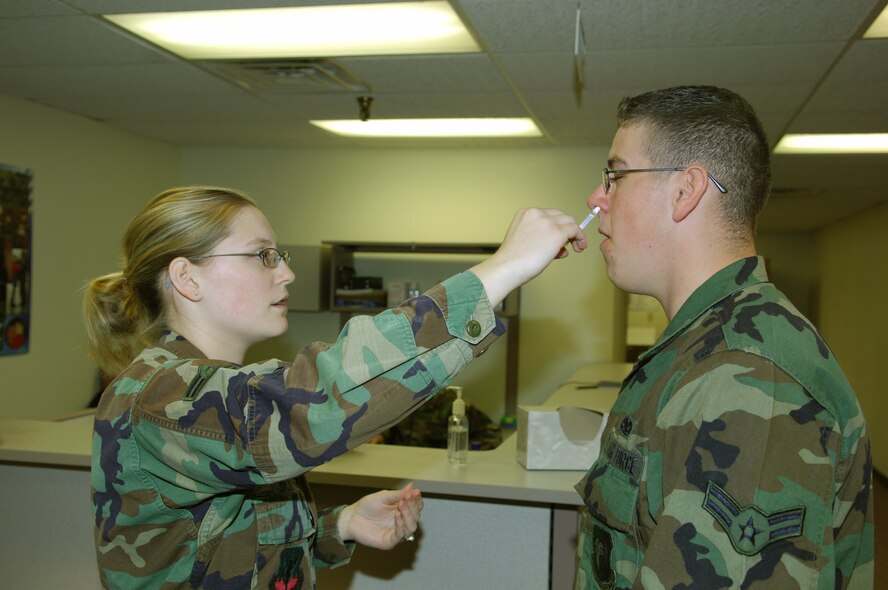 MINOT AIR FORCE BASE, N.D. – Airman 1st Class Samantha Brown, 5th Medical Operations Squadron medical technician, administers a flu vaccination to Airman 1st Class Sean Piotrowski, 5th Aircraft Maintenance Squadron weapons loader, here Sept.16. Flu vaccinations are currently being administered to Minot AFB Airmen, and are scheduled to be available for dependents in late October or early November. (U.S. Air Force photo by Senior Airman Cassandra Jones)