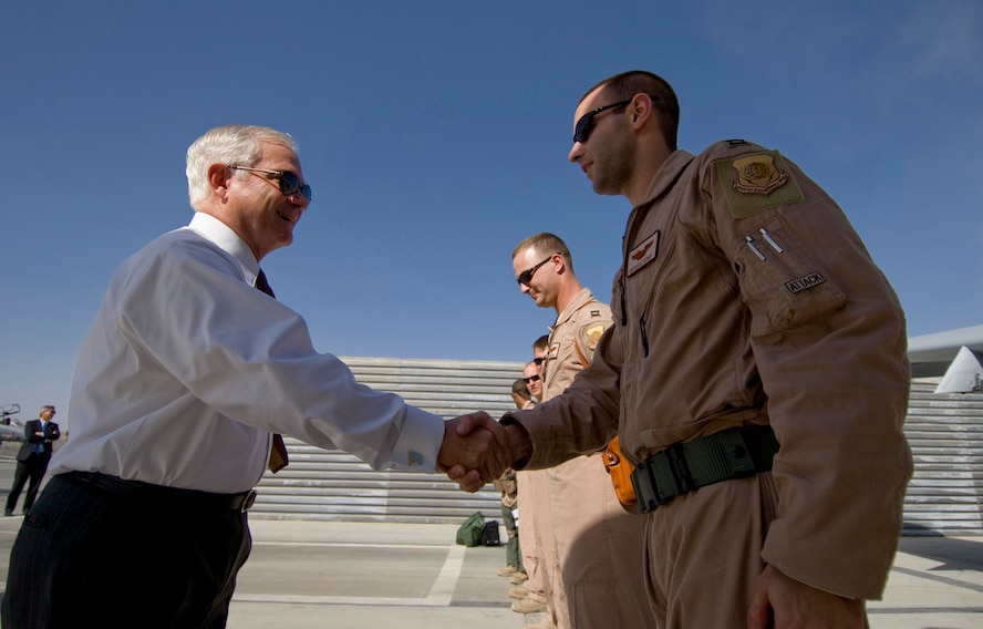 Secretary of Defense Robert M. Gates shakes hands with A-10 Thunderbolt II pilot Capt. Michael Kump Sept. 17 at Bagram Airfield, Afghanistan. Captain Kump is deployed from Moody Air Force Base, Ga. (U.S. Air Force photo/Staff Sgt. Samuel Morse) 