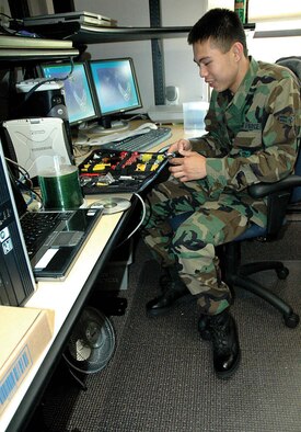 Airman 1st Class John Magno, 446th Aircraft Maintenance Squadron client support administrator, inspects his tools of the trade in determining which one would best fit the job at hand.  Airman Mango is a Reservist at McChord Air Force Base, Wash.