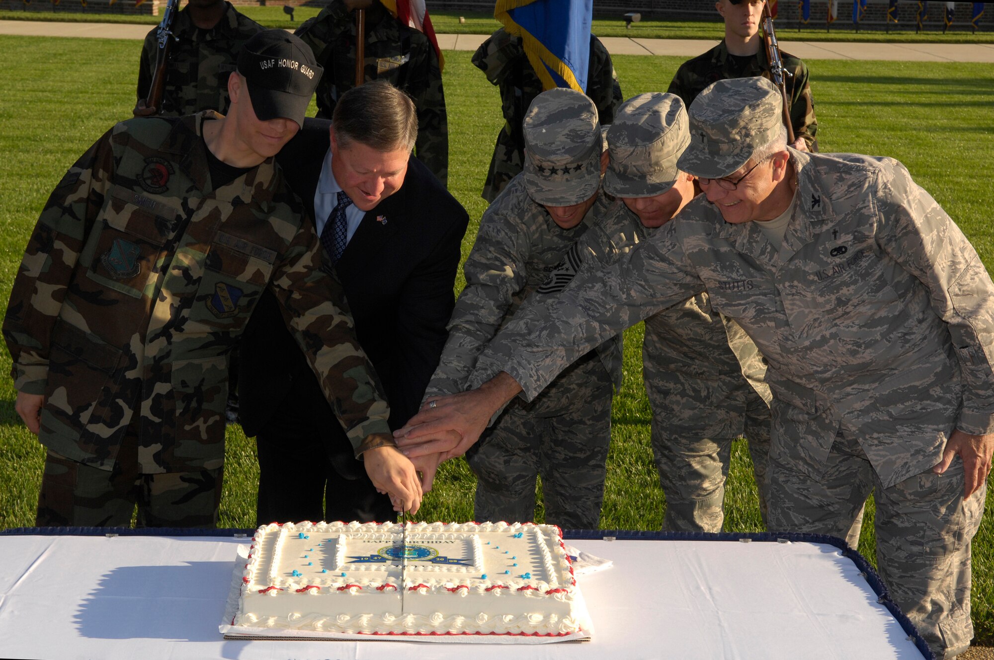 (From left to right) Airman 1st Class Damen Smith, U.S. Air Force Honor Guard; Honorable Michael Donley, acting secretary of the Air Force; Gen. Norton Schwartz, chief of staff of the Air Force; Chief Master Sgt. Rodney McKinley, chief master sergeant of the Air Force; and Chaplain (Col.) Charlie Stutts, Arlington National Cemetery senior chaplain, cut the Air Force’s 61st birthday cake Sept. 18 on the U.S. Air Force Ceremonial Lawn on Bolling. Airman Smith and Colonel Stutts where chosen to cut the cake as the youngest and oldest members of the 11th Wing. The Air Force is celebrating 61 years as an independent organization after separating from the Army Air Corps in 1947. (U.S. Air Force photo by Airman 1st Class Sean Adams)
