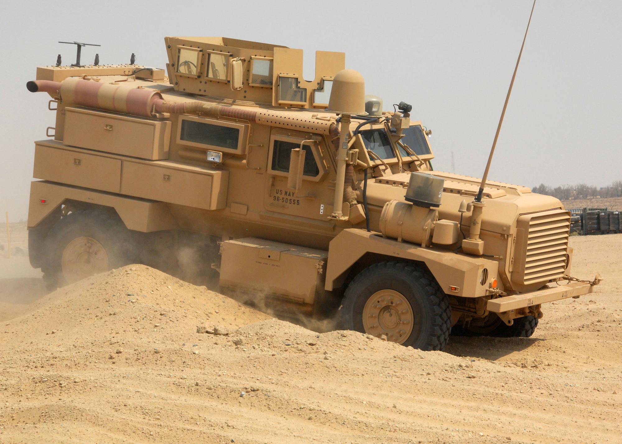 SOUTHWEST ASIA -- Air Force Explosive Ordinance Disposal technicians practice driving a Mine Resistant Ambush Protected Vehicle through a sand course on Sep. 4 at an air base in Southwest Asia. The MRAP training course is taught in a joint-service environment to simulate real world experiences military members will encounter while deployed to bases in the U.S. Central Command area of responsibility. The Department of Defense has purchased more than 5,200 MRAP vehicles for servicemembers. (U.S. Air Force photo/Tech. Sgt. Raheem Moore)