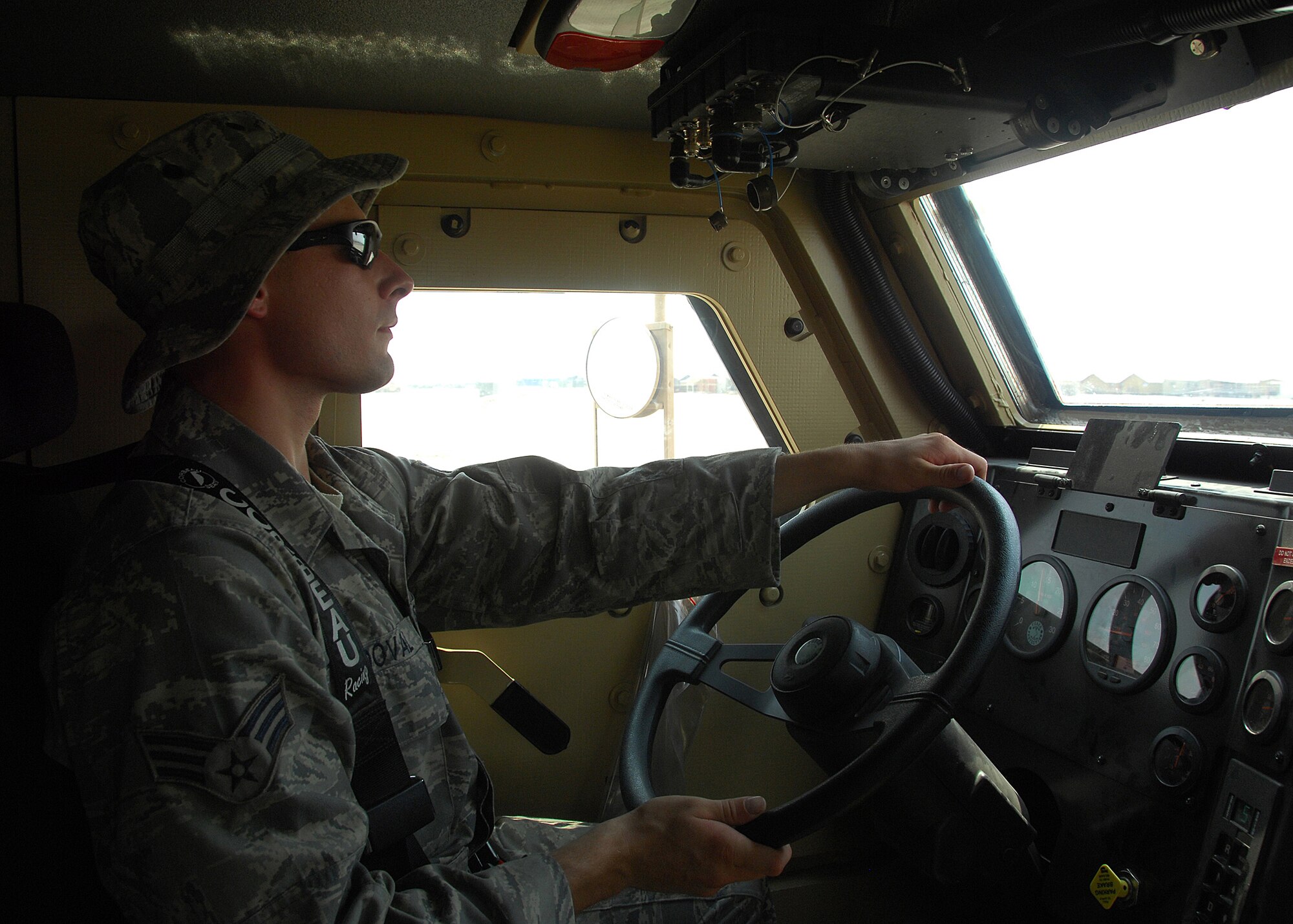 SOUTHWEST ASIA -- Senior Airman Jeffrey Sandoval, 386th Expeditionary Civil Engineer Squadron, drives a Mine Resistant Ambush Protected vehicle through a sand course on Sep. 4 at an air base in Southwest Asia. U.S. Navy and Air Force members learned how to drive the vehicle during a two-day course taught in a joint training environment. The Department of Defense has purchased more than 5,200 MRAP vehicles for servicemembers in the U.S. Central Command area of responsibility. Airman Sandoval is deployed from Shaw Air Force Base, S.C. (U.S. Air Force photo/Tech. Sgt. Raheem Moore)