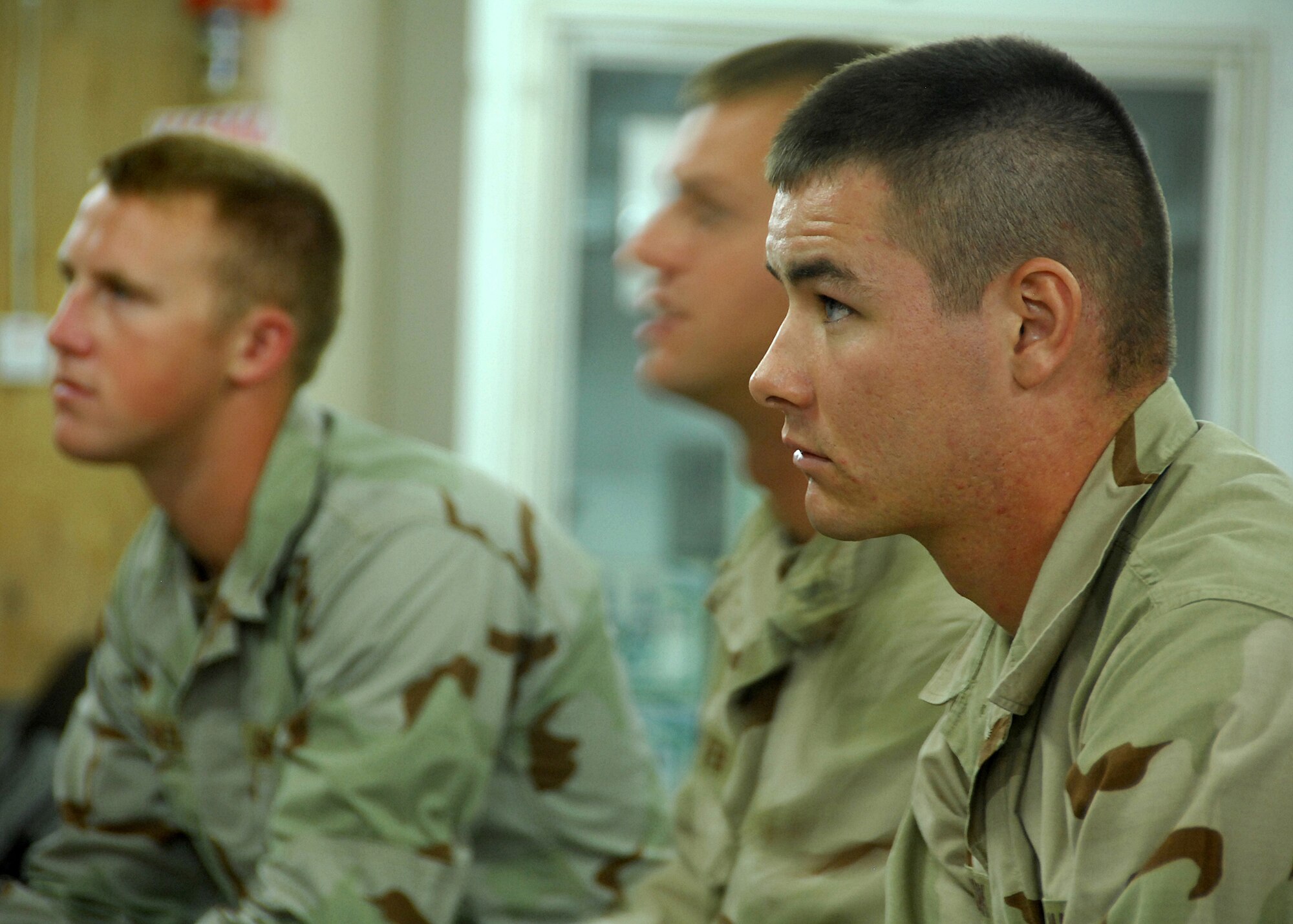 SOUTHWEST ASIA -- Sailors listen intently as Dave Towery, Mine Resistant Ambush Protected Vehicle Cougar series instructor, explains how to operate the vehicle in a combat environment on Sep. 4 at an air base in Southwest Asia. The MRAP training course is taught in a joint-service environment to simulate real world experiences military members will encounter while deployed to bases in the U.S. Central Command area of responsibility. The Department of Defense has purchased more than 5,200 MRAP vehicles for servicemembers. (U.S. Air Force photo/Tech. Sgt. Raheem Moore)