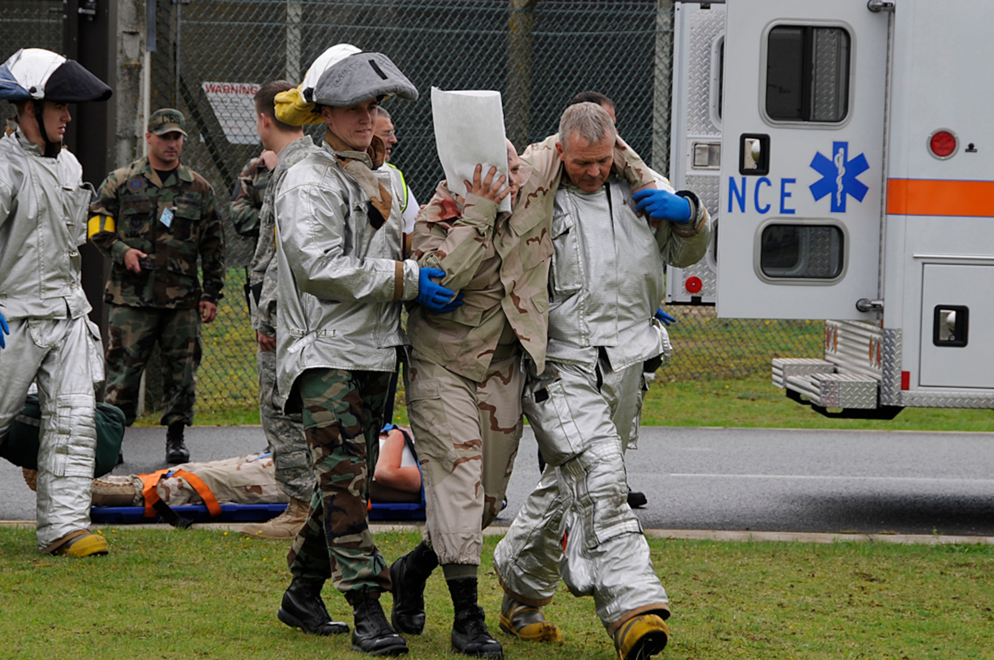 Emergency personnel clear the scene of a disaster during a mass casualty exercise at RAF Lakenheath, England, Sept. 11. The exercise helped increase awareness and gave people across the base a chance to prepare in case of a real world event.  (U.S. Air Force photo by Senior Airman Brian J. Ellis)