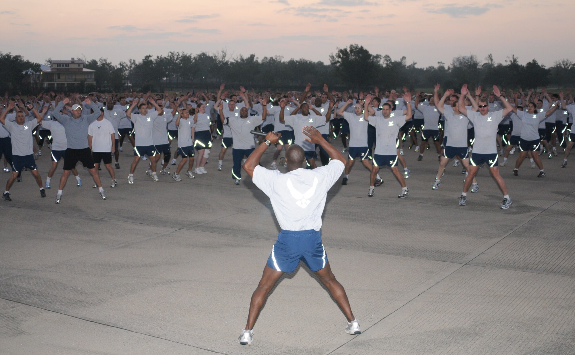 Master Sgt. Quardrick Brumfield, 81st Training Wing, leads hundreds of Keesler Airman in warm-up exercises.  The Airman participate in a 2-mile run on the flight line in celebration of the Air Force's 61st birthday.  (U.S. Air Force photo by Kemberly Groue)