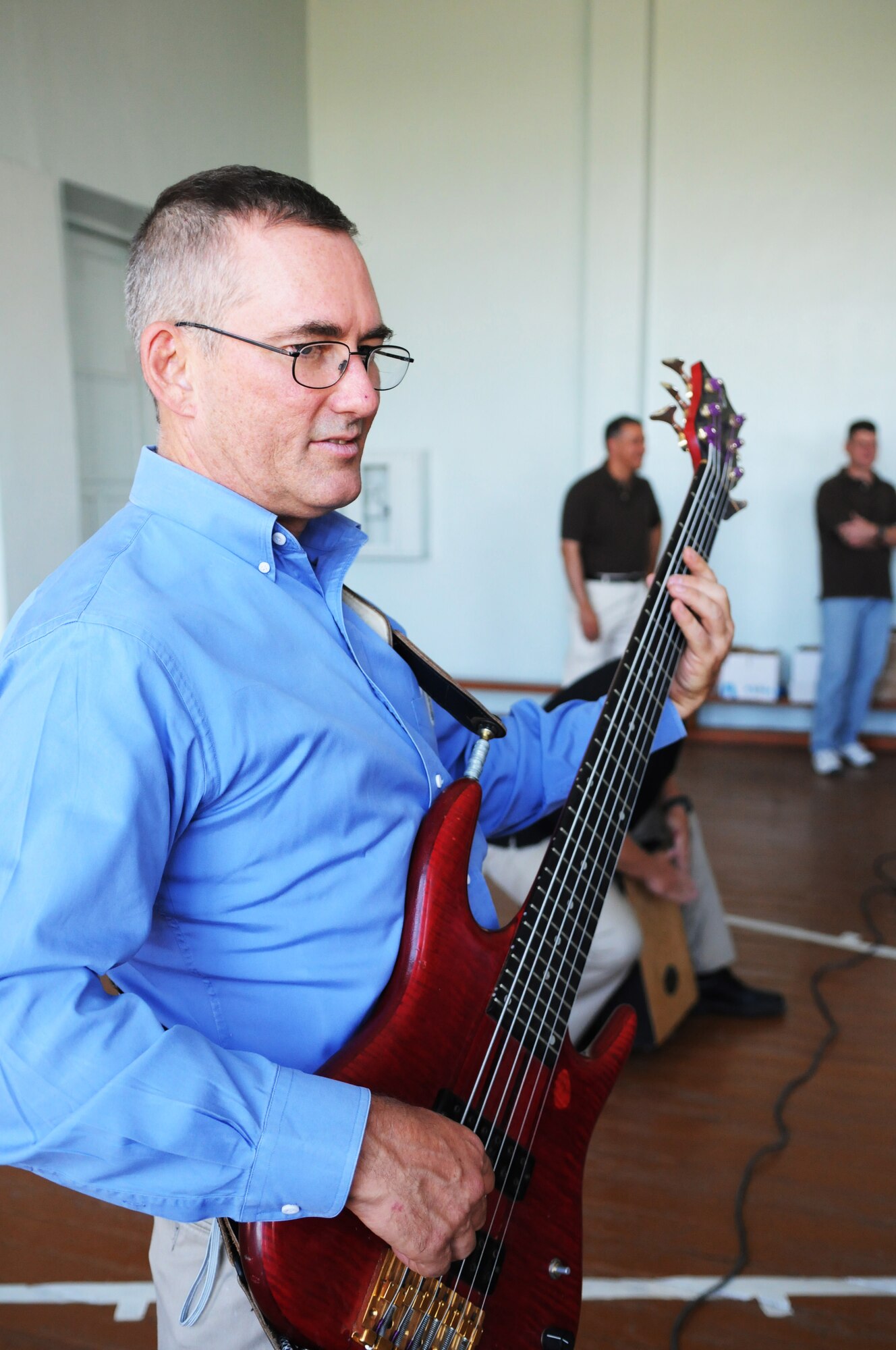 MANAS AIR BASE, KRYGYZ REPUBLIC - Tech. Sgt. Dave Foster, Yuma guitarist, entertains an unlikely yet excited audience at the Bishkek School for the Deaf. Although deaf, the audience felt the vibrations of the music and enjoyed the performance as much if not more than the hundreds of others who saw the band perform during their eight day tour at Manas AB. The U.S. Air Forces Central band played ten concerts in several schools villages and at orphanages, as well as on base for the servicemembers deployed here. (Air Force photo / Senior Airman Ruth Holcomb)
