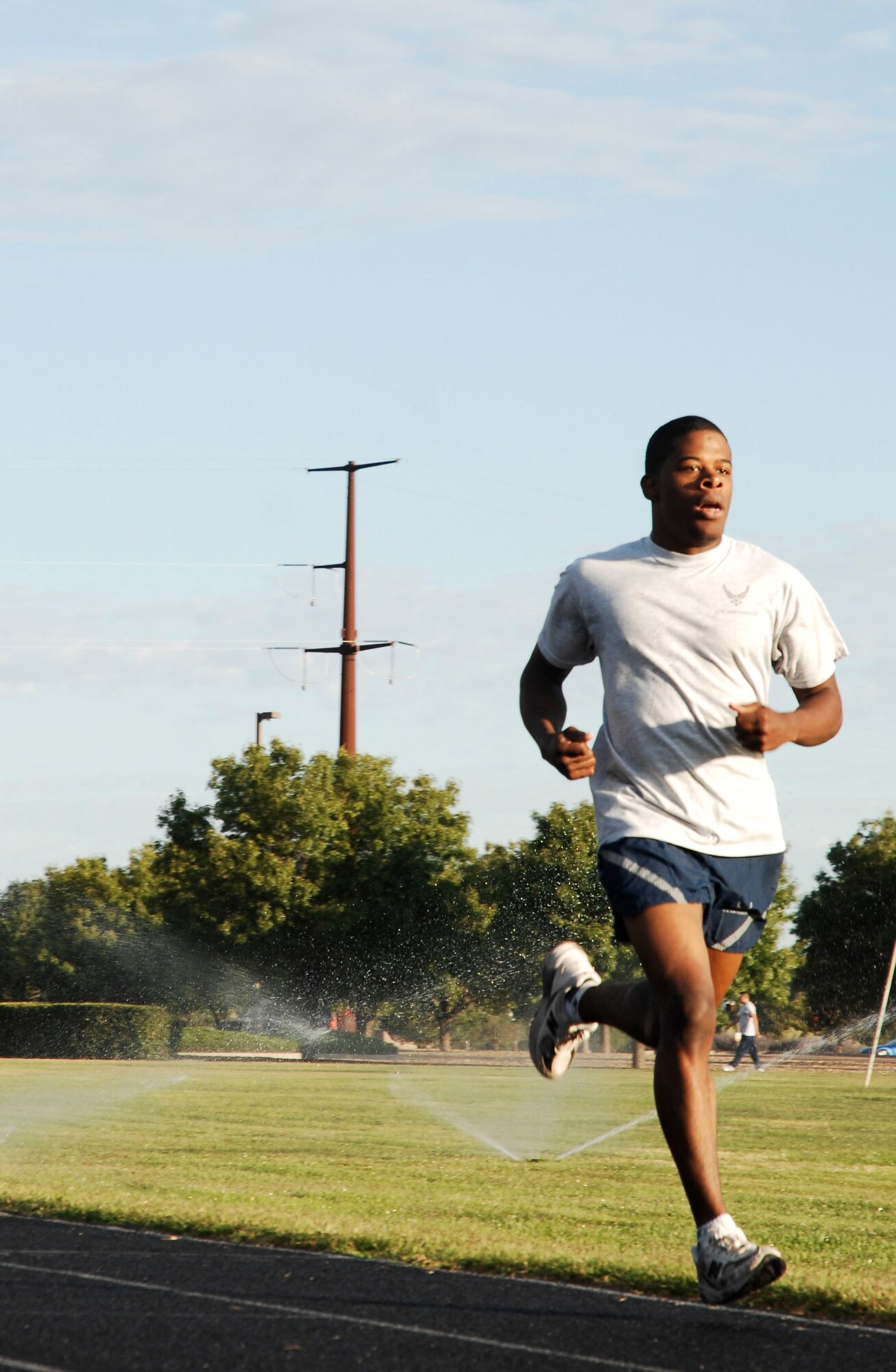 CANNON AIR FORCE BASE, N.M. -- Senior Airman Marc Hightower, 27th Special Operations Component Maintenance Squadron, finishes a mile run during a competition Sept. 18. The run for the fastest male/female competition was hosted by the 27th Special Operations Services Squadron. (U.S. Air Force photo/Senior Airman Liliana Moreno) 