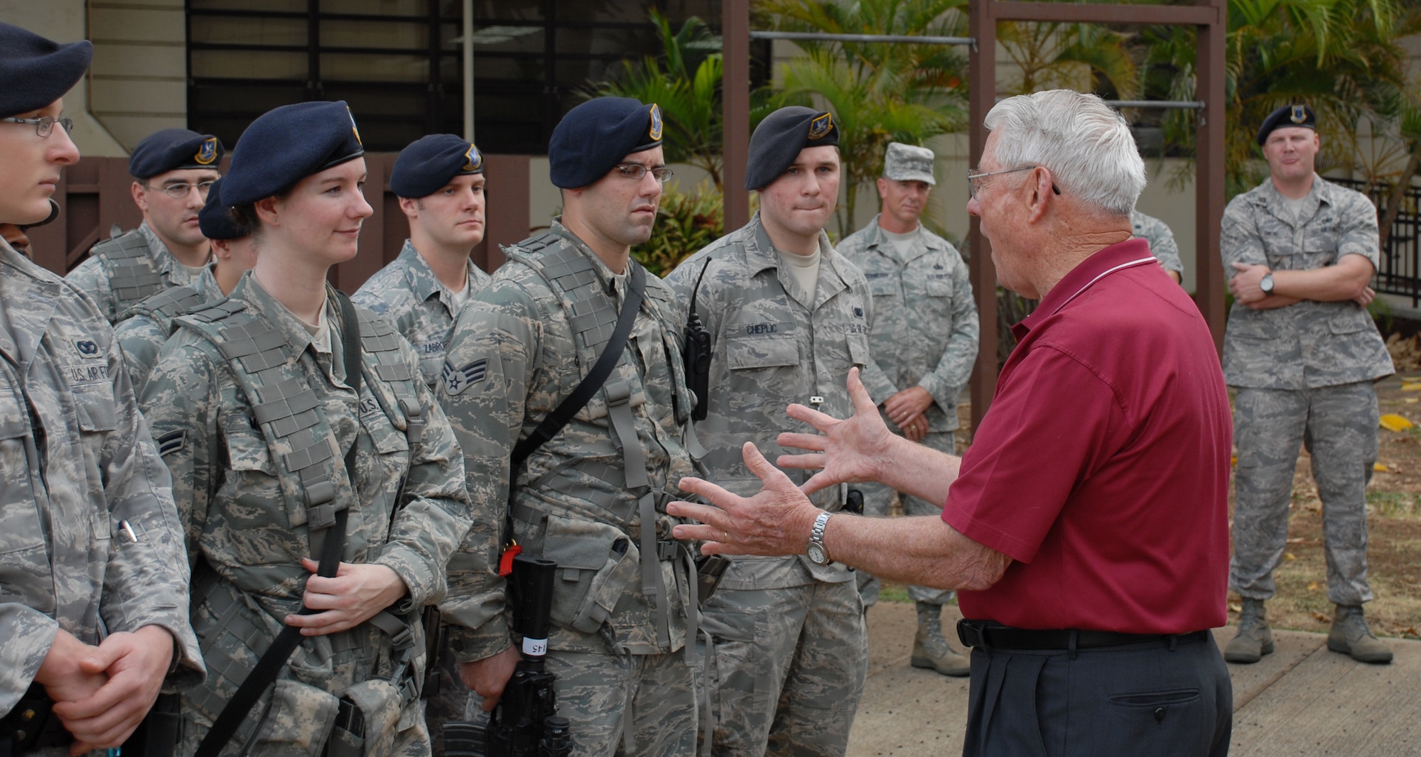 Chief Master Sergeant of the Air Force, retired, Robert Gaylor, offers words of encouragement to members of the 15th Security Forces Squadron during an evening guard mount. The chief, who retired before many of the Airmen in formation were born, still has a soft spot in his heart for Security Forces, as he was a Security Forces member coming up through the enlisted ranks. (U.S. Air Force Photo/Staff Sgt. Erin Smith)