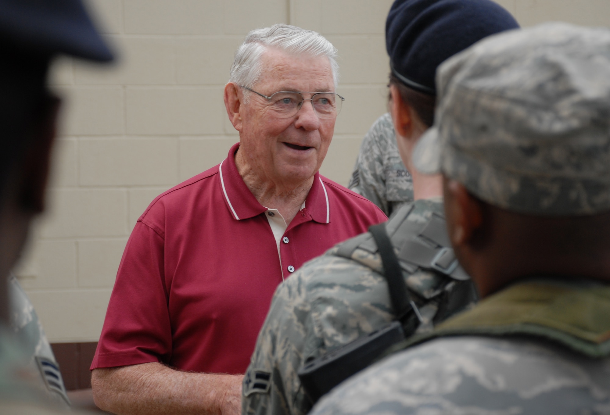 Chief Master Sergeant of the Air Force, retired, Robert Gaylor, visits members of the 15th Security Forces Squadron during an evening formation. The fifth chief master sergeant of the Air Force, retired from the Air Force 29 years ago but still visits bases around the world to offer words of encouragement and advice to junior Airmen. (U.S. Air Force Photo/Staff Sgt. Erin Smith)