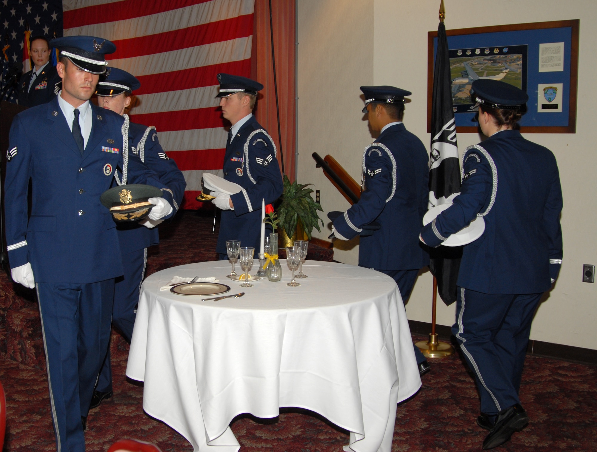 Members of the Tyndall Air Force Base Honor Guard perform a ceremony at the National POW/MIA Recognition Day luncheon at the Touch and Go club here today.  (U.S. Air Force photo/Lisa Norman)