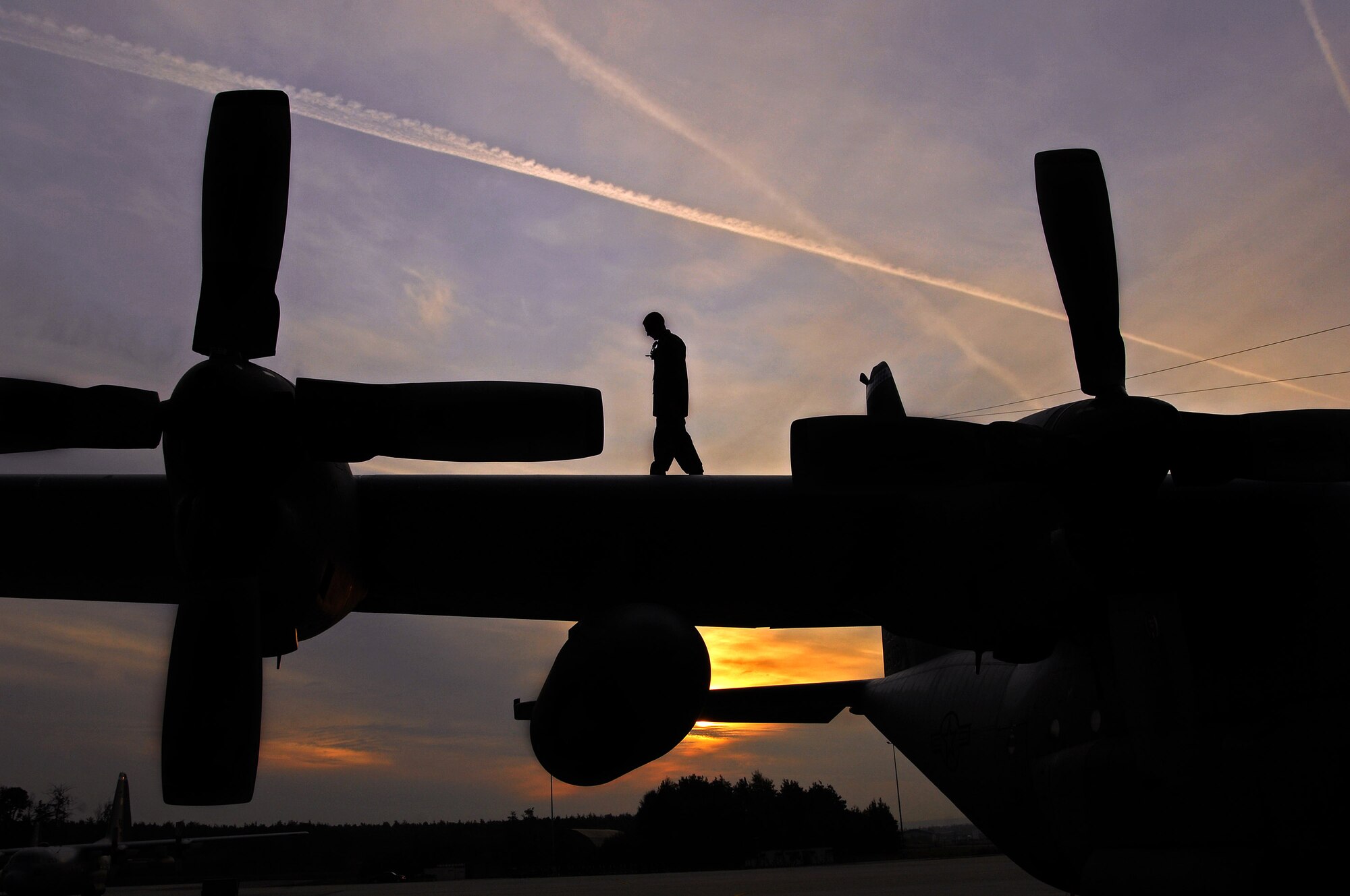 Airman 1st Class Phillip Bean performs a preflight inspection on a C-130 Hercules aircraft at Ramstein Air Base, Germany, Sept. 18. Airman Bean is assigned to the 86th Aircraft Maintenance Squadron as a crew chief. (U.S. Air Force photo/Airman 1st Class Kenny Holston) 
