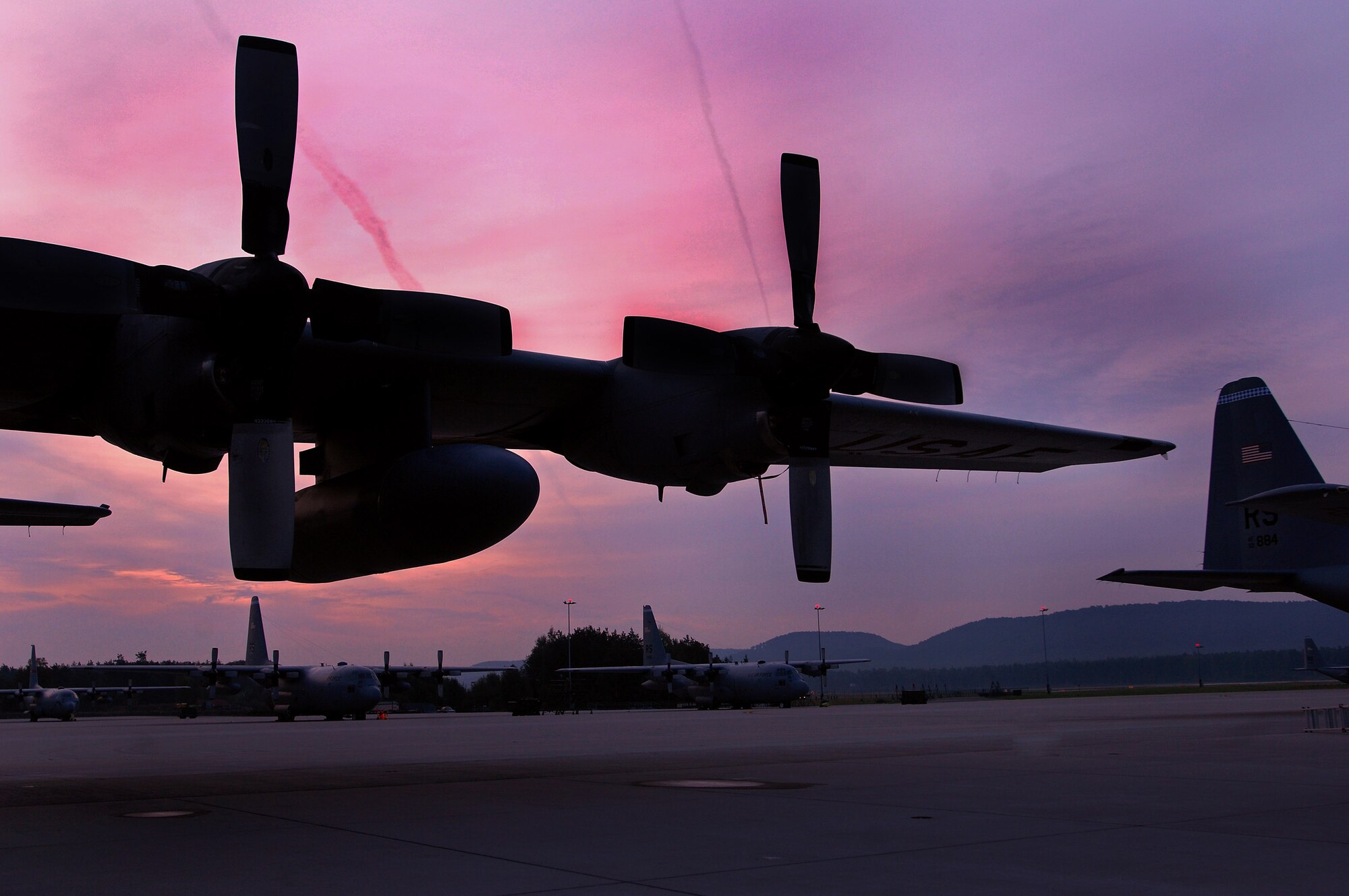 The sun rises over a prepped C-130 Hercules aircraft ready for daily missions at Ramstein Air Base, Germany, Sept. 18. The Ramstein flightline is one of the busiest in the Air Force, launching more than 40 aircraft each day. (U.S. Air Force photo/Airman 1st Class Kenny Holston) 
