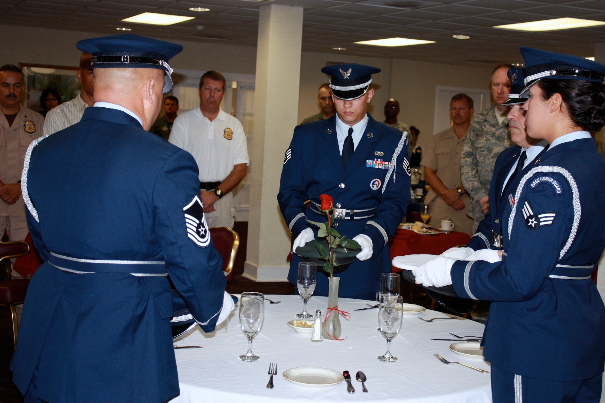 Members of the 482nd Fighter Wing Honor Guard perform a special ceremony in honor of National Prisoner of War/Missing in Action Recognition Day at Homestead Air Reserve Base, Fla., on Sept. 19. Over 100 military and civilian personnel from units across the base and the local community attended the event.  “We will make the observance breakfast an annual event to pay our respects and honor the brave servicemen who served their country under very difficult circumstances and to those who paid the ultimate price fighting for our freedom." said Col. William B. Binger, 482nd FW commander.  (U.S. Air Force photo/TSgt Lionel Castellano)