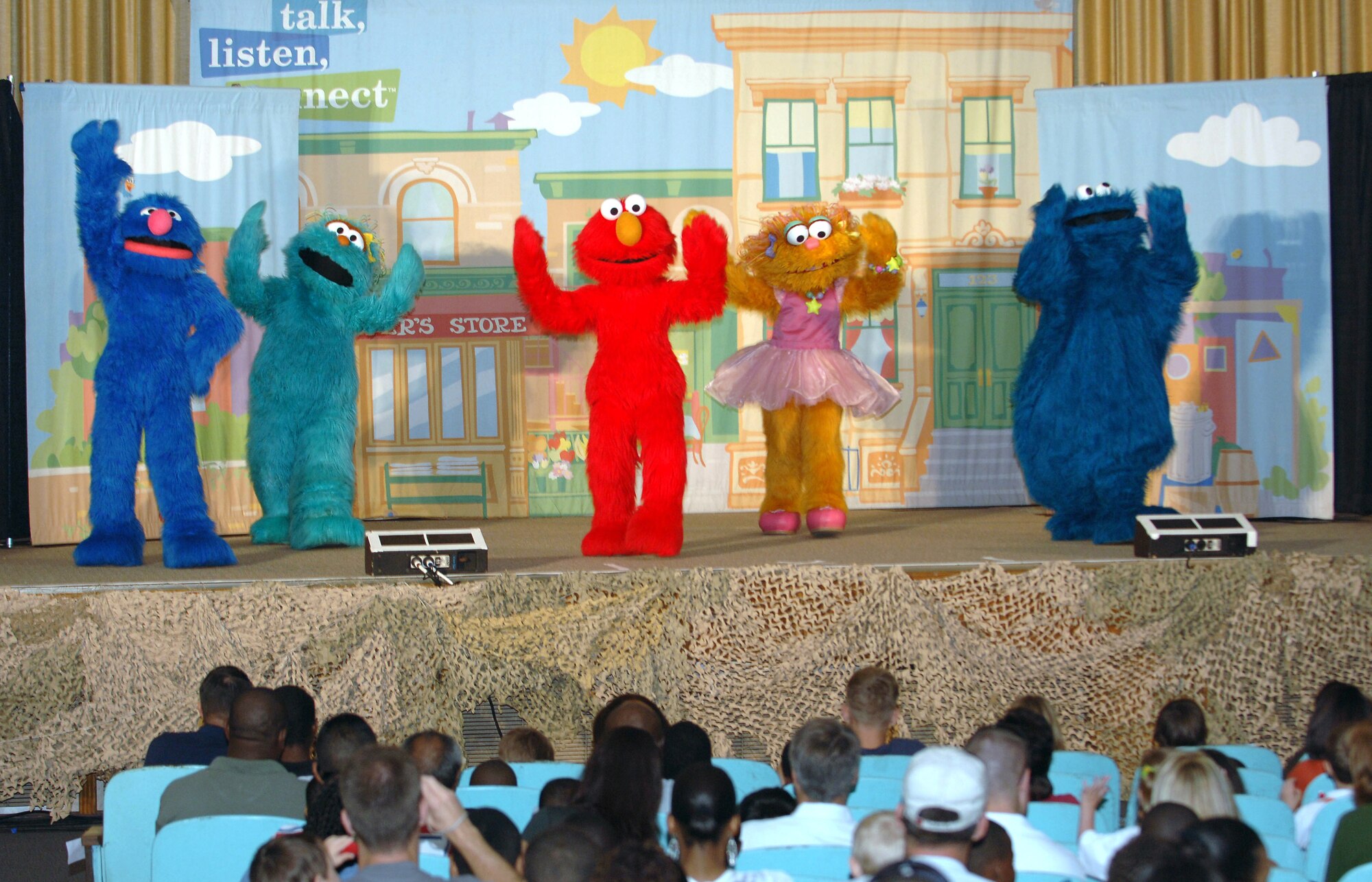 Sesame Street characters perform for MacDill Air Force Base auidence members during a live performance at the Base Theater Sept. 13. Seseame Street live is sponsored by the USO and Sesame Workshop to create a dialog between children and parents about the challenges of deployment, homecomings and changes in parents. (U.S. Air Force photo by Senior Airman Rachel Cunningham)