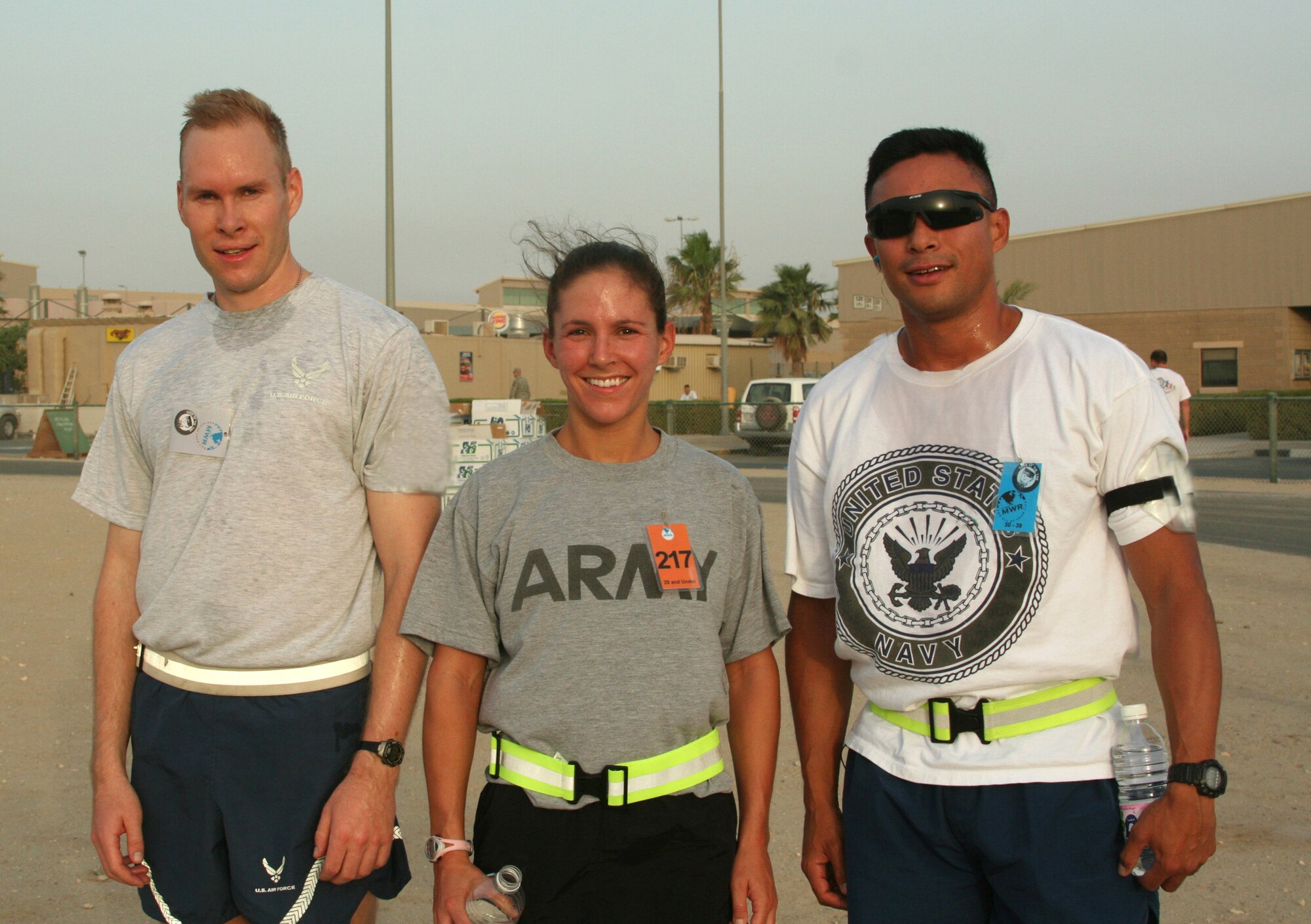 Dan Pearson (left) finished third overall in the Air Force 5K birthday fun run Sept. 18 at Camp Arifjan, Kuwait. His time was 19 minutes and 4 seconds. Emily Potter of the Army came in first place at 18:07 Eric Szabo of the Navy finished second running the race in 18:52. (U.S. Air Force photo/Staff Sgt. W. Watson Martin) 