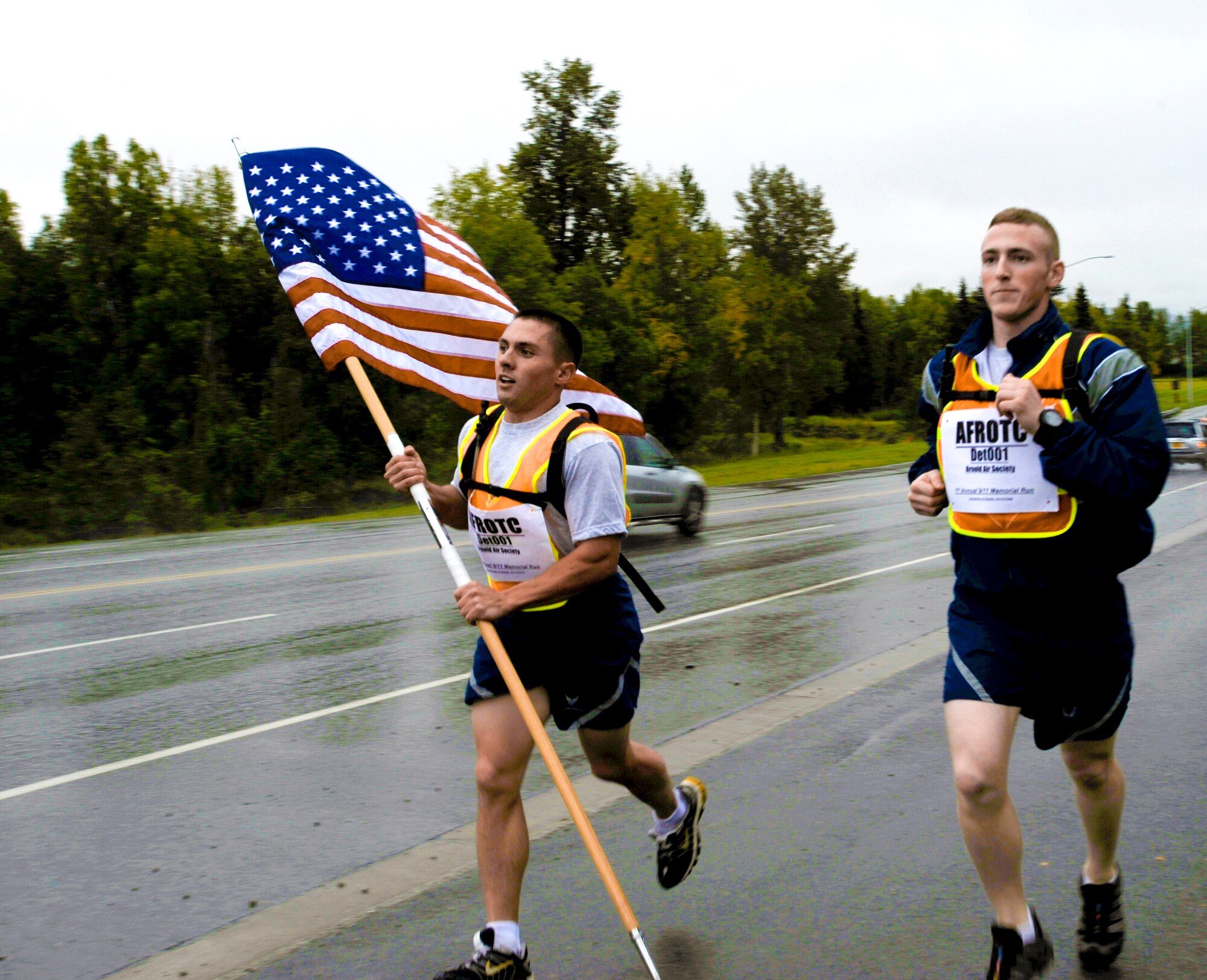 ELMENDORF AIR FORCE BASE, Alaska?Air Force Cadets Maj. Micheal Blahut and 1st Lt. Tyler Siegal from the University of Alaska, Anchorage kick off their 9-11 run Sept. 12. The run was organized to show support of the Armed Forces fighting terrorism and in remembrance 9-11. The run lasted 24 hours with nearly 100 runners taking shifts of 30 minutes. (U.S. Air Force photo/Senior Airman Matthew Owens)