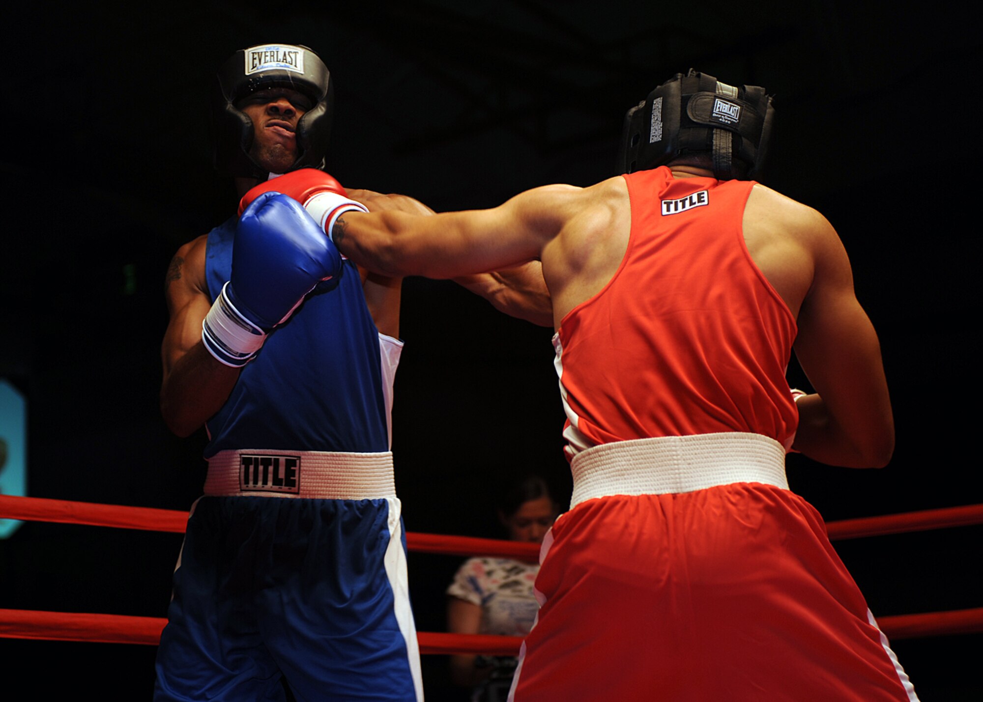 Airman 1st Class Willie Bivins, 49th Maintenance Squadron, lands a punch on Senior Airman Darius Jones, 49th Operations Support Squadron, during their boxing match at the "Raptor Rumble 2," Sept. 12. The fight lasted all three one minute rounds and Airman Bivins won by unanimous decision. (U.S Air Force photo/ Airman 1st Class DeAndre Curtiss)