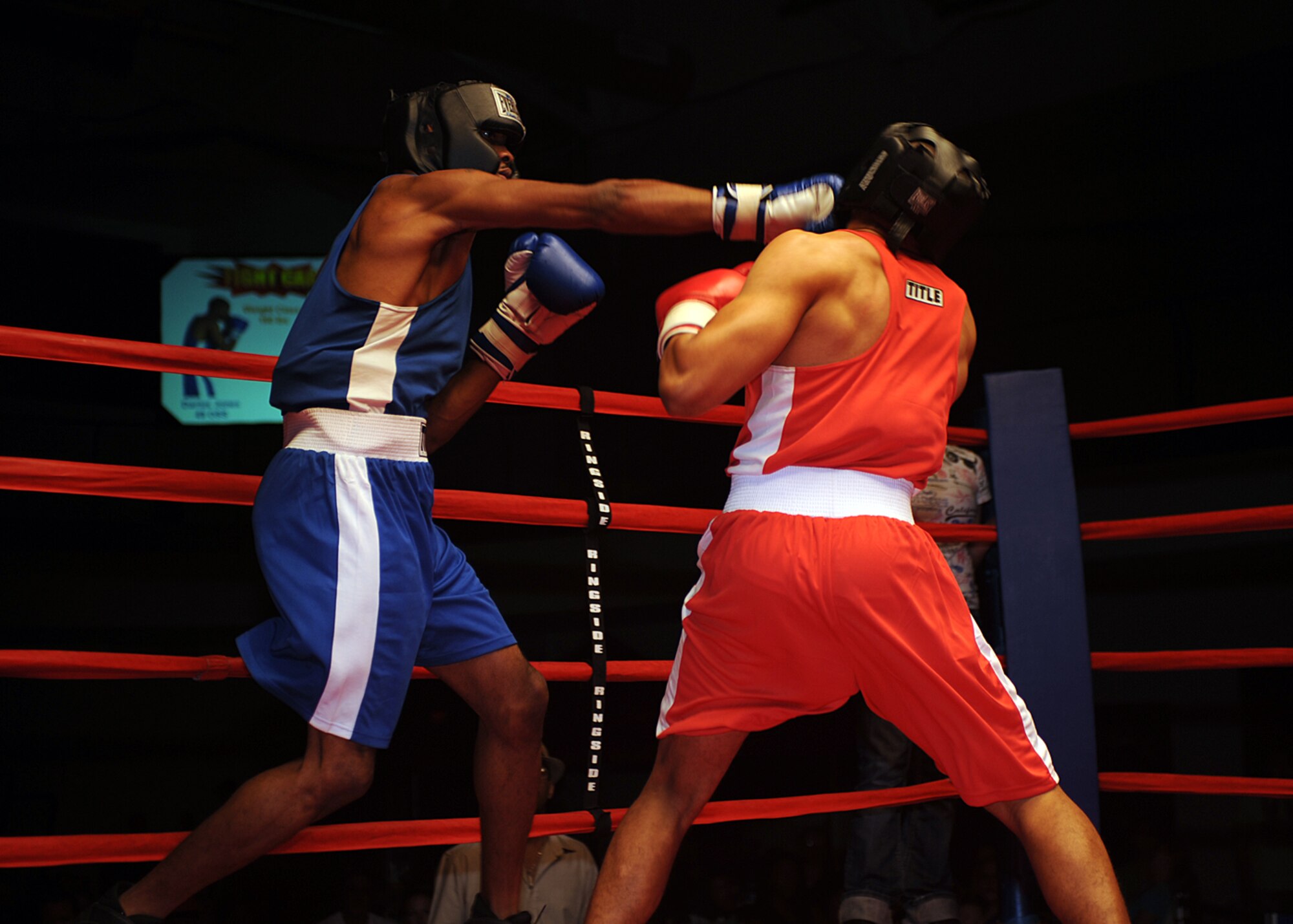 Senior Airman Darius Jones, 49th Operations Support Squadron, lands a punch on Airman 1st Class Willie Bivins, 49th Maintenance Squadron, during their boxing match at the "Raptor Rumble 2," Sept. 12. Airman Jones and Airman Bivins fought in the 160 pound weight class. (U.S Air Force photo/ Airman 1st Class DeAndre Curtiss)