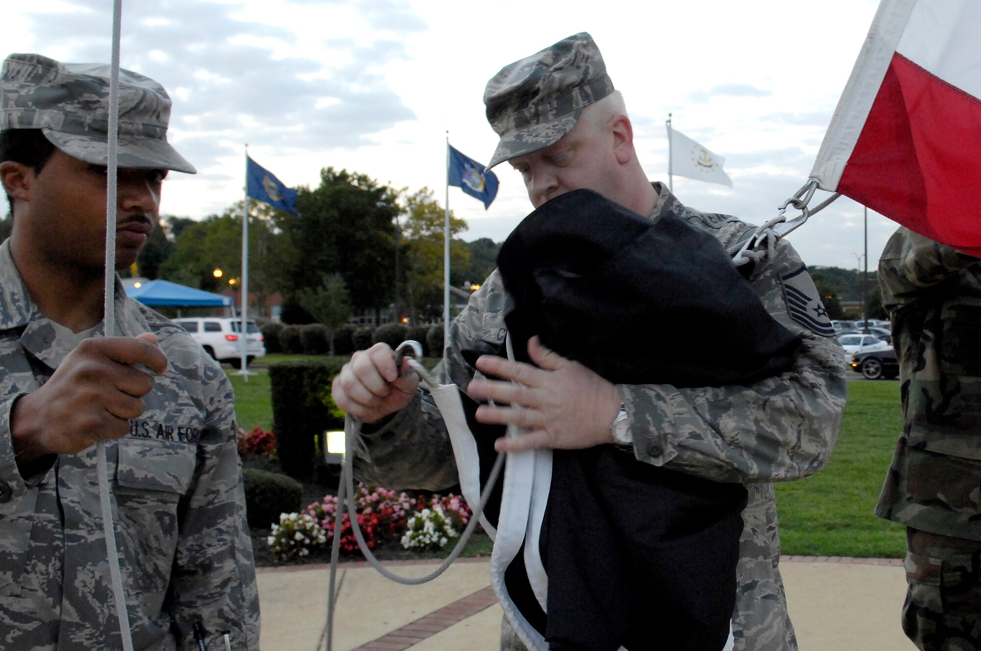 Master Sgt. Kenneth Causie, Material Support Agency, attaches a POW/MIA flag Sept. 19 to the flagpole on Bolling. Sergeant Causie and the Pentagon chapter of the Air Force Sergeants Association organized the raising of the POW/MIA flag as part of Bolling's remembrance of POW/MIA Day.  (U.S. Air Force Photo by Senior Airman Dan DeCook)