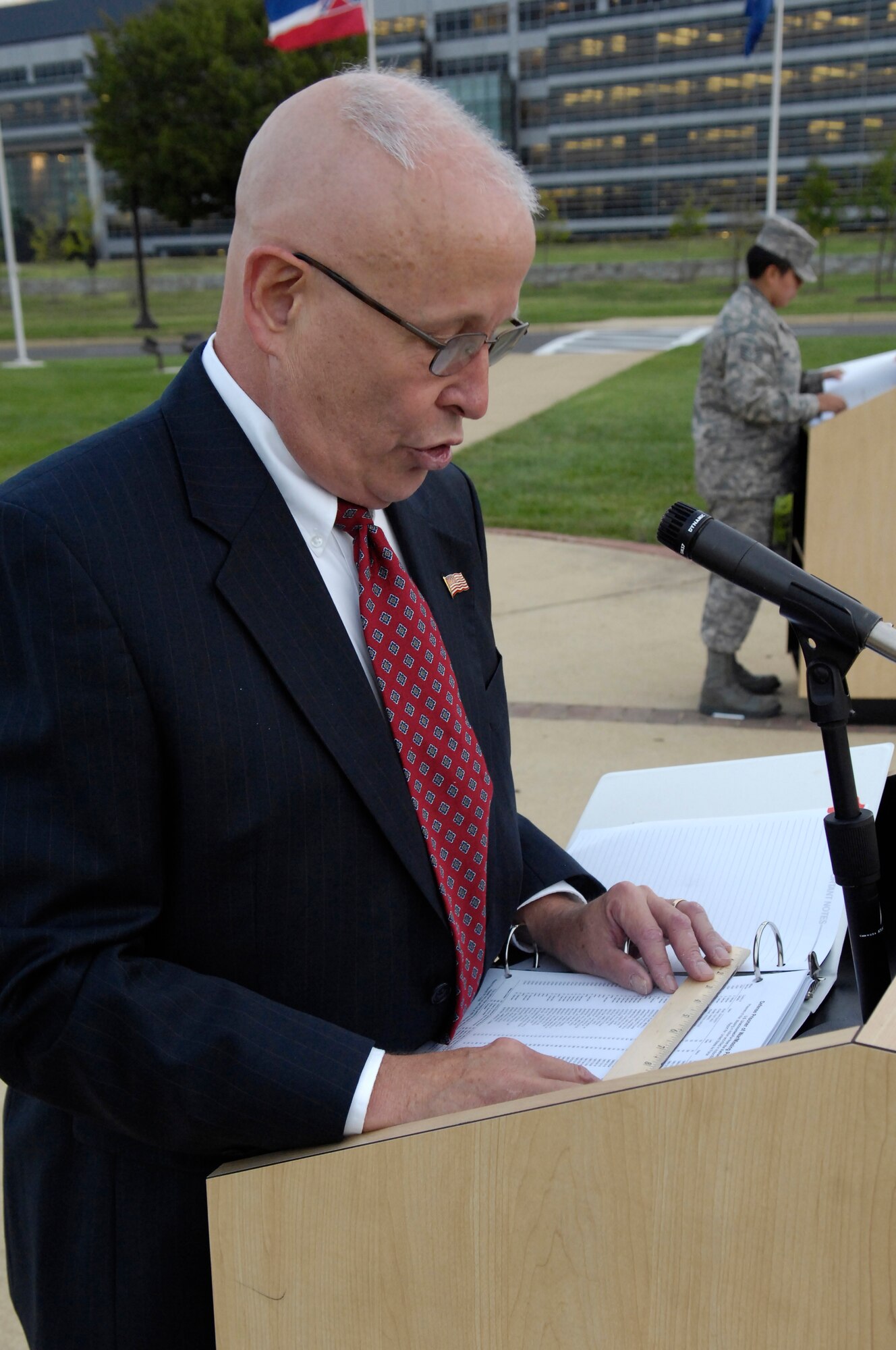 Richard Eyermann, 30-year Air Force and Vietnam veteran, reads the names of prisoners of war and those missing in action from the Korean and, Vietnam War and World War II Sept. 19 on Bolling. Reading of the names was part of Bolling's celebration of the National POW/MIA Day. (U.S. Air Force Photo by Senior Airman Dan DeCook)
