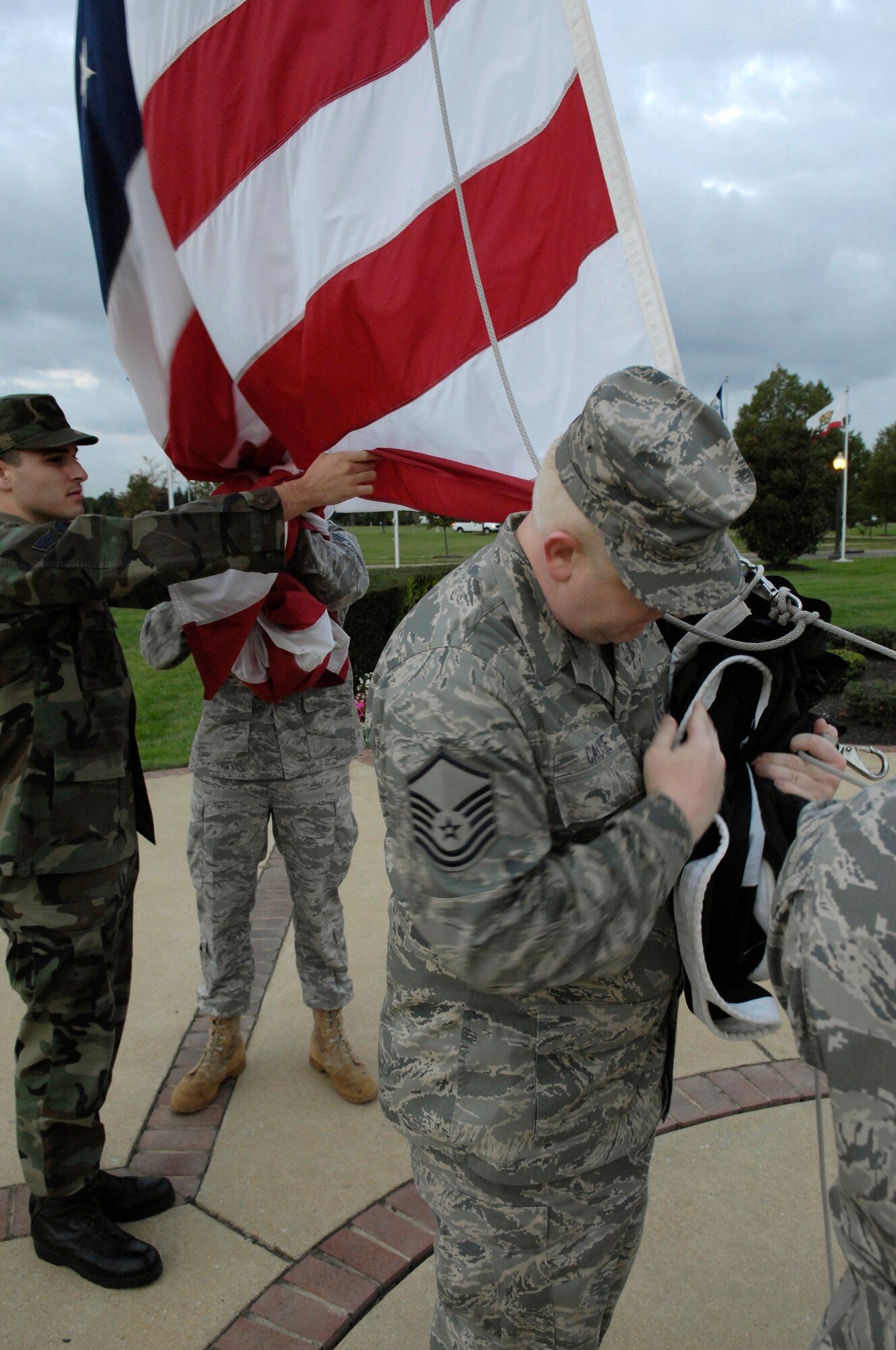 Airmen from the National Capital Region attach a POW/MIA flag Sept. 19 to the flagpole on Bolling. The flag was attached during a reveille ceremony as part of the National POW/MIA Day. (U.S. Air Force Photo by Senior Airman Dan DeCook)