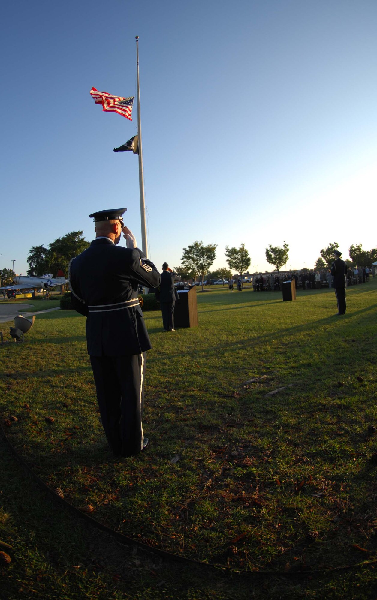 SHAW AIR FORCE BASE, S.C. -- Airmen of the 20th Fighter Wing salute the American flag during Reveille at the beginning of the POW/MIA Ceremony Sept. 19 hosted by Col. James Post, 20th FW commander. The ceremony started with a formation of Air Force and Army and concluded with a 21-gun salute, taps and a missing man fly by. Servicemembers of Shaw gathered for the ceremony to show appreciation to those who gave more of themselves than most. (U.S. Air Force photo/Staff. Sgt. Patrick Mitchell)
