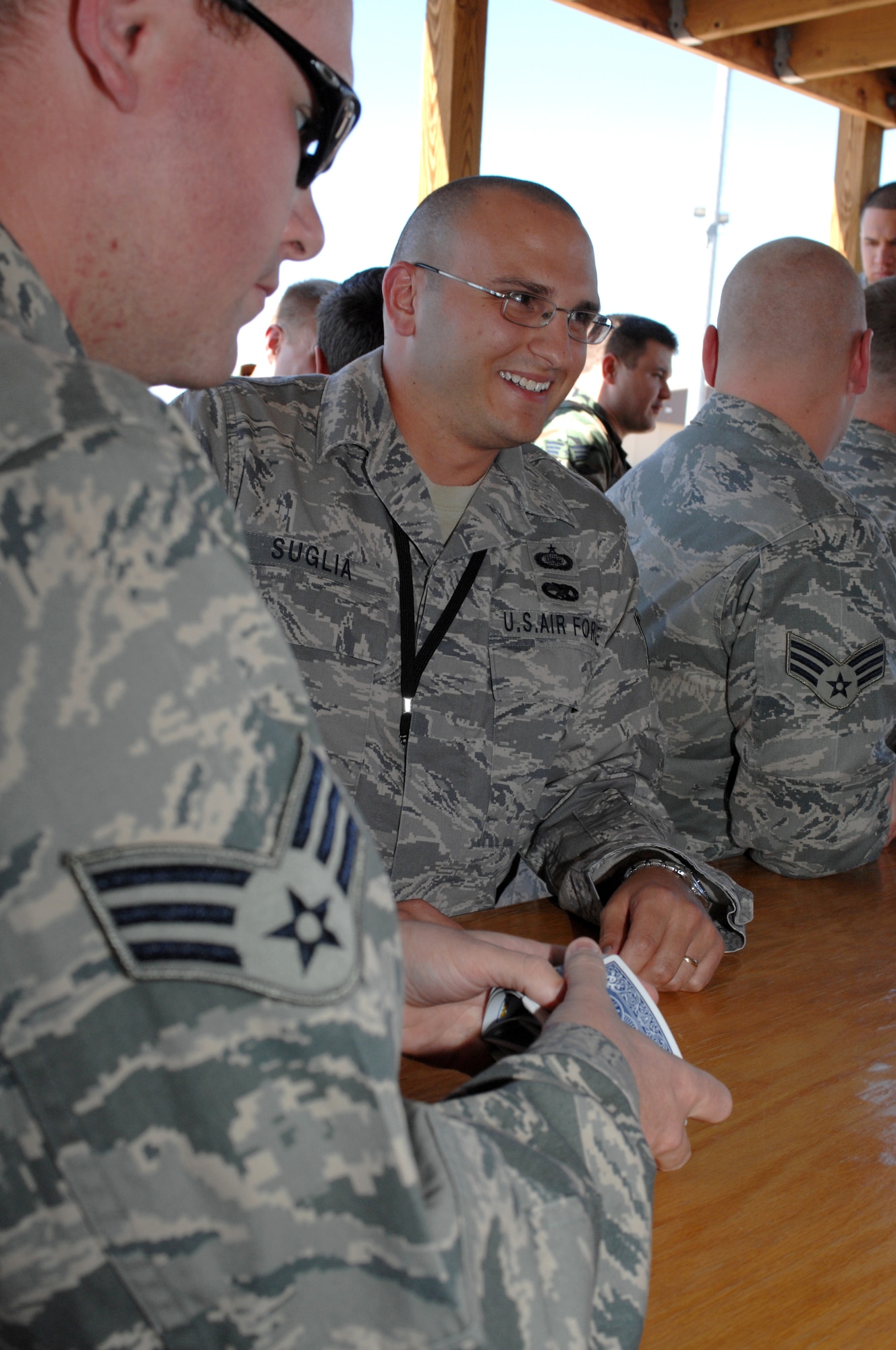 Tech. Sgt. Michael Suglia, 49th Operations Support Squadron, smiles while playing cards during the Air Force birthday celebration outside the 7th Fighter Squadron at Holloman Air Force Base, N.M., September 16. The squadron held a small celebration with snacks, drinks and birthday cake in celebration of the Air Force?s birthday which is officially September 18, 1947. (U.S. Air Force photo/Airman Sondra M. Escutia)