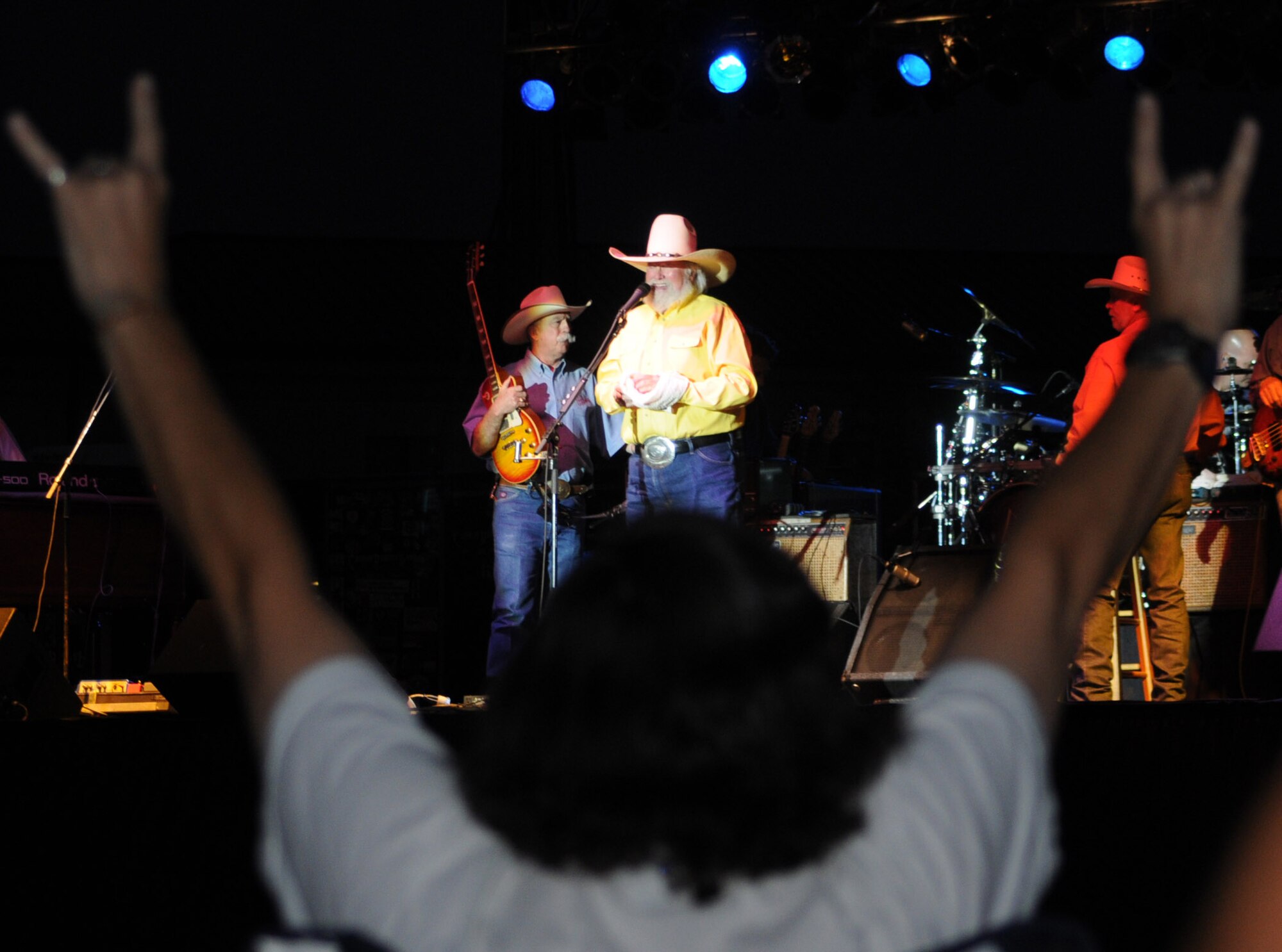 An audience member shows his support as Charlie Daniels performs at Keesler Air Force Base as part of the base's Air Force birthday celebration Sept. 18.  Prior to performing for the crowd Mr. Daniels met with base leadership and Airmen who earned Bronze Stars for their actions in Iraq.  (U.S. Air Force photo by Kemberly Groue)
