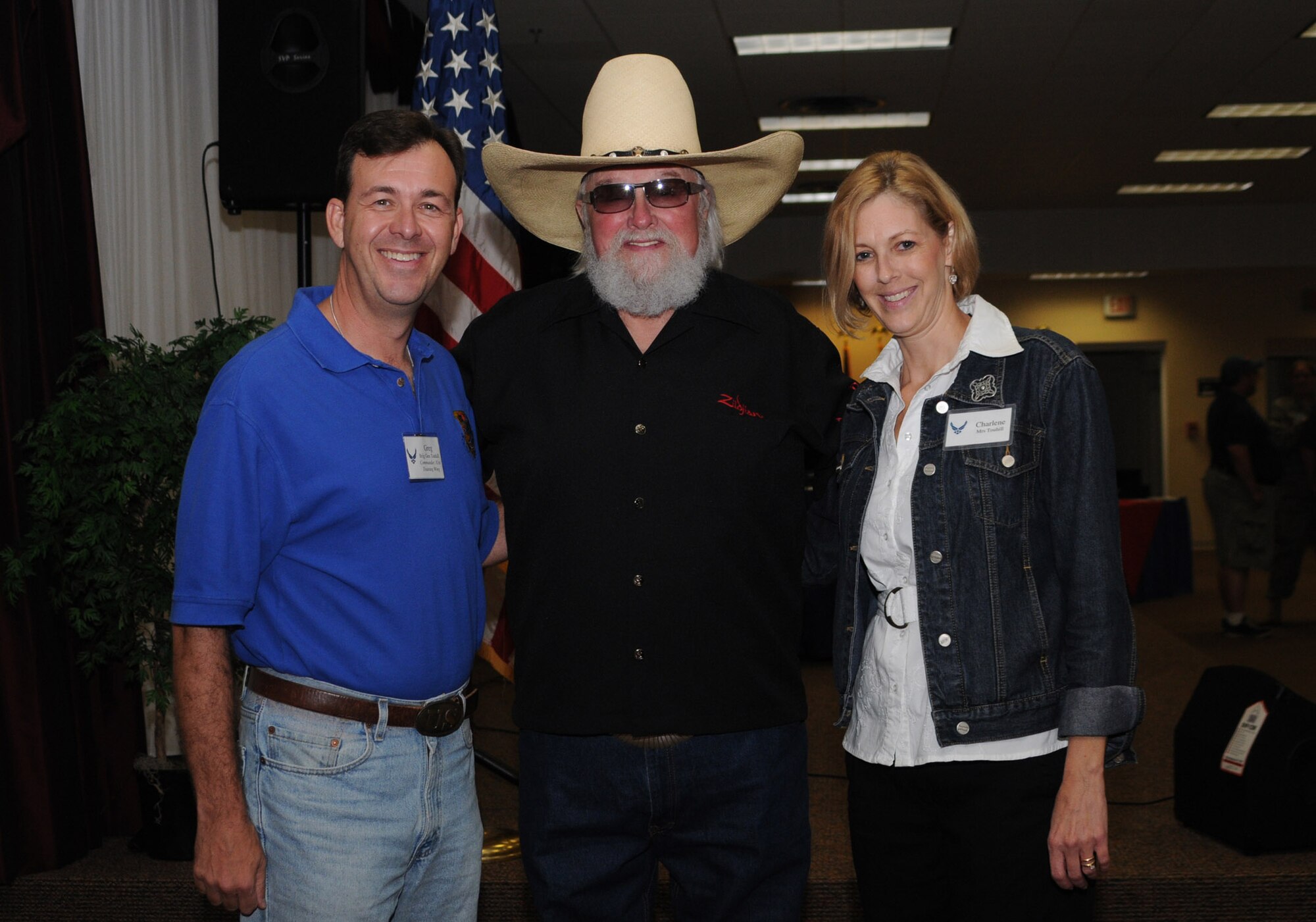 Brig. Gen. Greg Touhill, 81st Training Wing commander, and wife Charlene, pose for a photo with Charlie Daniels at a pre-concert reception.  As part of Keesler Air Force Base's Air Force birthday celebration, the Charlie Daniels Band met with base leadership, community members and Bronze Star recipients at the reception before performing for the base populace and many local community members.  (U.S. Air Force photo by Kemberly Groue)