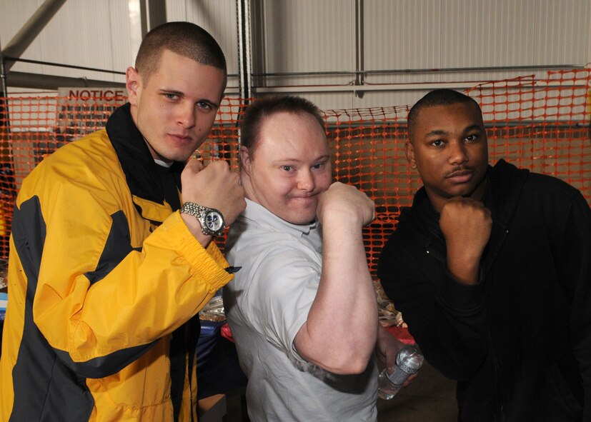 Airman First Class Ryan Thorpe and Donte Davis flex their muscles with Andrew Norrington during the 27th annual “Joan Mann Special Sports Day” event held at RAF Mildenhall, on Sept. 13, 2008. (U.S. Air Force photo by Staff Sergeant Jerry Fleshman)
