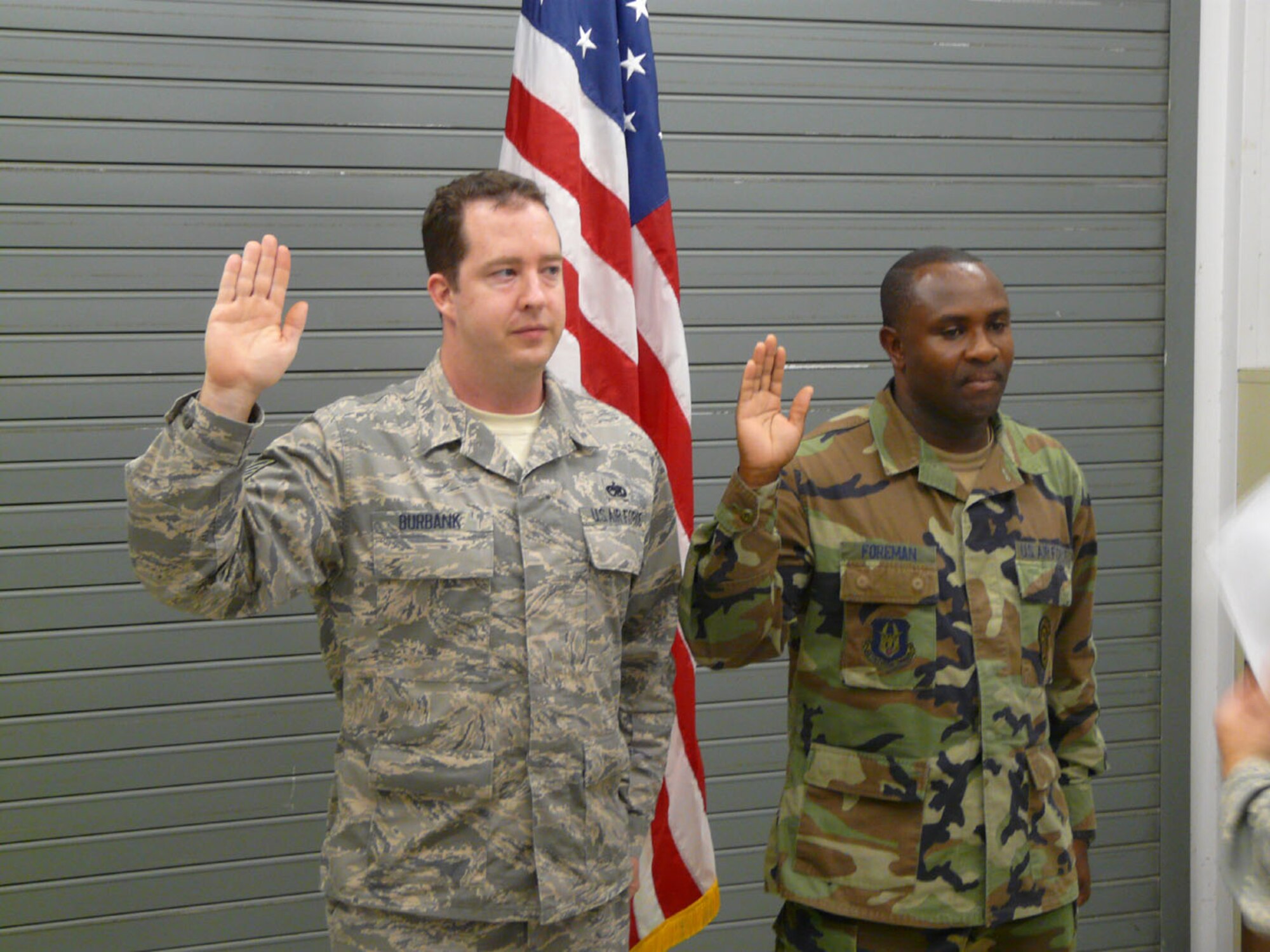 SEYMOUR JOHNSON AIR FORCE BASE, N.C. -- Staff Sgt. Roger P. Foreman and his supervisor Tech. Sgt. Michael T. Burbank renew their commitment to the Air Force Reserve in September. The two network infrastructure technicians reenlisted for six  years. They were sworn in by 916th Communication Squadron Commander Lt. Col. James T. Horton. Both reservists have been members of the 916th for more than 10 years.