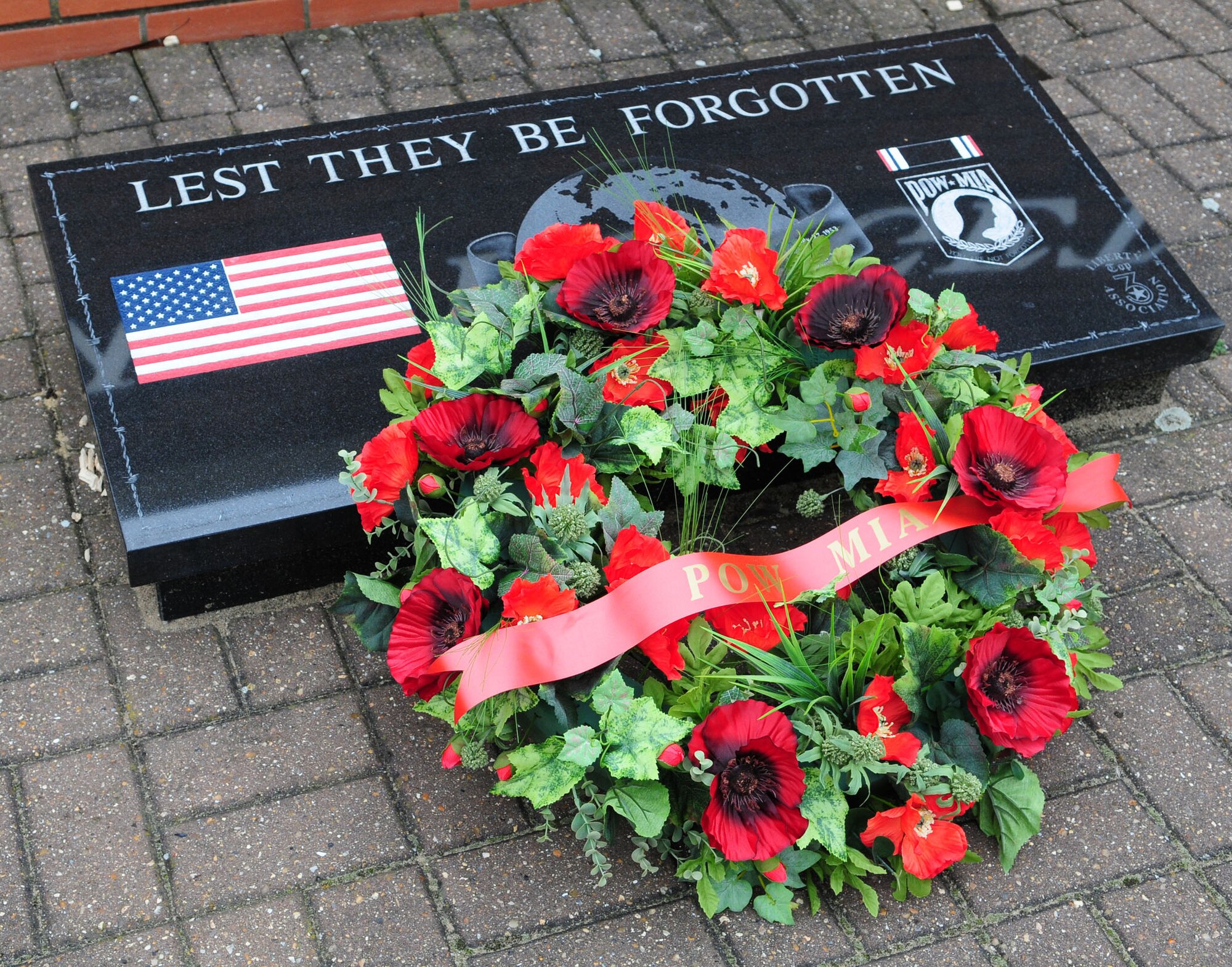 A wreath was laid at Memorial Park at RAF Lakenheath by the 'Lest we Forget' wall. Rolling Thunder was a motorcycle ride made up of 52 riders, both military and civilian, from RAFs Mildenhall and Lakenheath, and was part of a week of events to remember those fallen, prisoners of war and missing in action. (U.S. Air Force photo by Karen Abeyasekere)