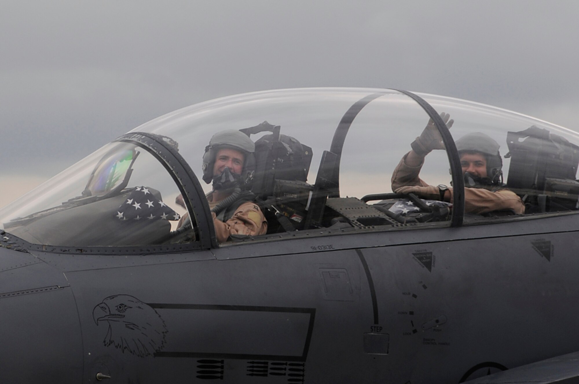 Aircrew members wait to taxi into a protective aircraft shelter at RAF Lakenheath, England, Sept. 8. The F-15 Strike Eagels, from the 494th Fighter Squadron, returned from Southwest Asia in support of Operation Enduring Freedom. (U.S. Air Force photo by Senior Airman Brian J. Ellis)