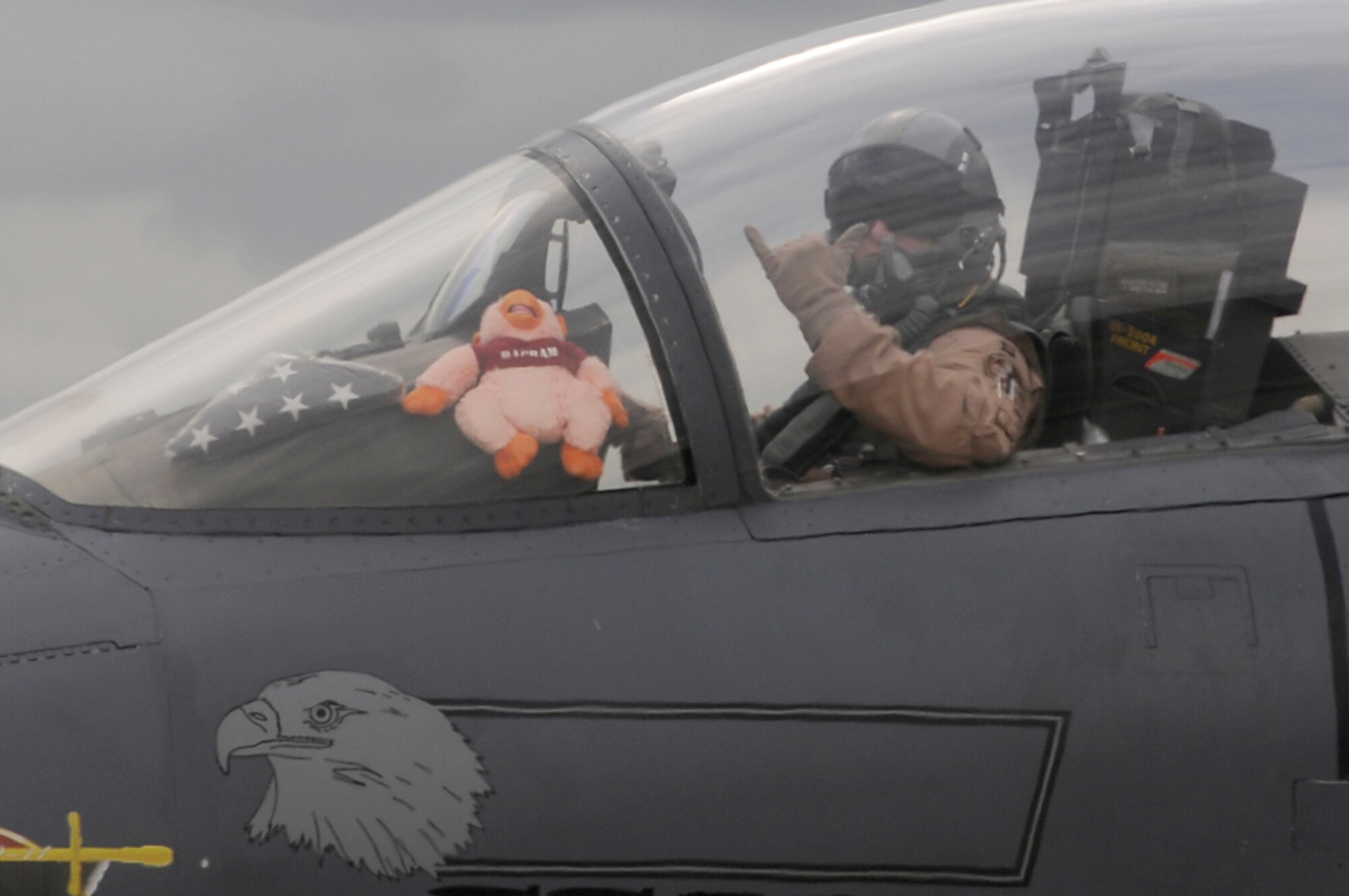 With high spirits, an F-15 Strike Eagle pilot waits to taxi at RAF Lakenheath, England, Sept. 8. The F-15 Strike Eagles, from the 494th Fighter Squadron, returned from Southwest Asia in support of Operation Enduring Freedom. (U.S. Air Force photo by Senior Airman Brian J. Ellis)