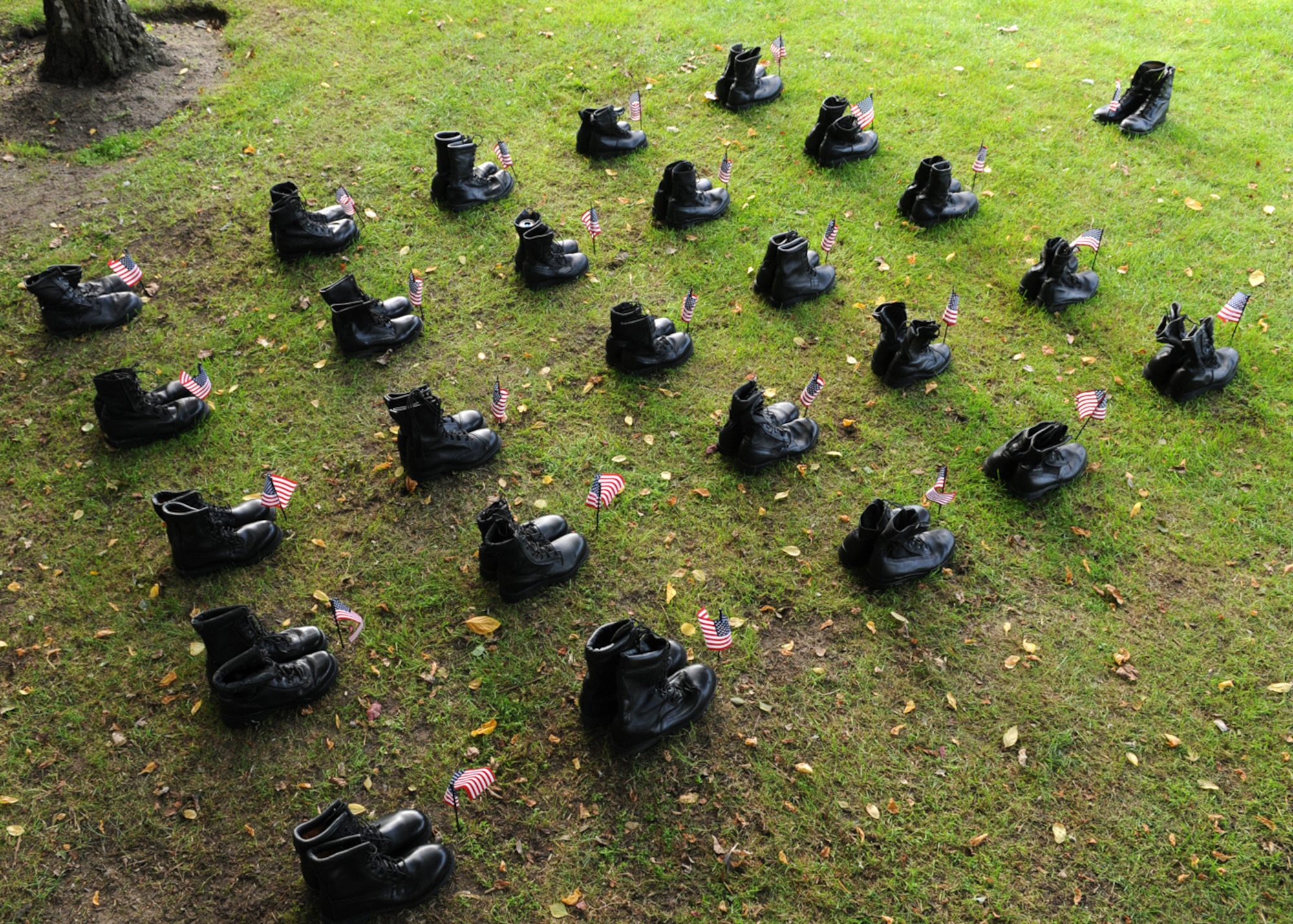 An array of boots are displayed in a small formation as a part of the Prisoner of War/Missing in Action 24-hour vigil during POW/MIA week here Sept. 18, 2008. The boots symbolize servicemembers who were either captured or lost their lives during wartime. (U.S. Air Force photo by Staff Sergeant Jerry Fleshman) 