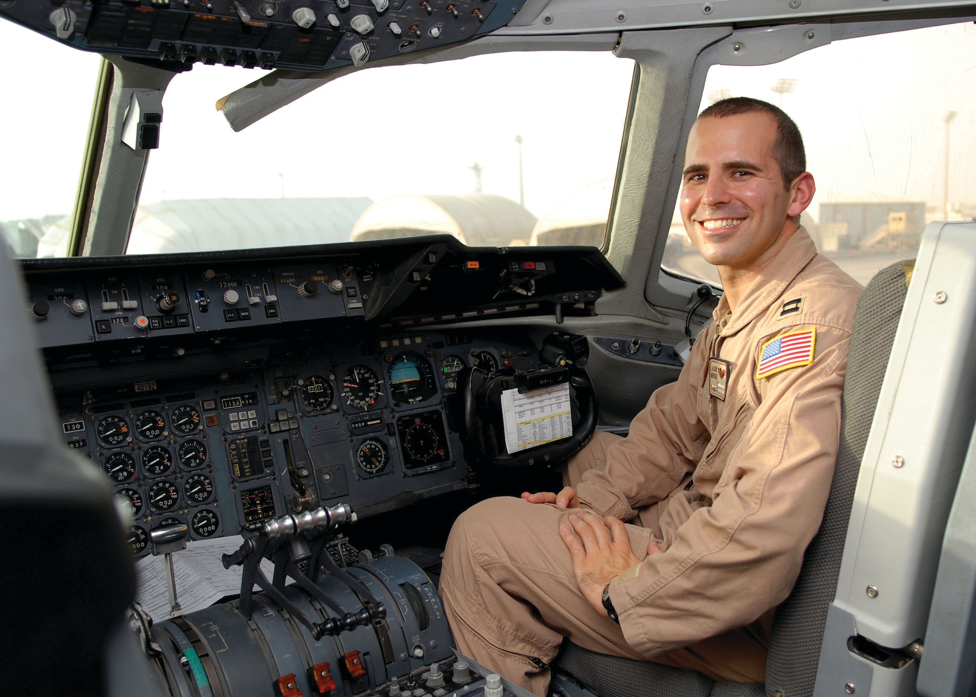 Capt. Jason Moraes, KC-10 pilot for the 908th Expeditionary Air Refueling Squadron, prepares to head out on a night mission from the 380th Air Expeditionary Wing Sept. 17. (U.S. Air Force photo/Tech. Sgt. Denise Johnson)