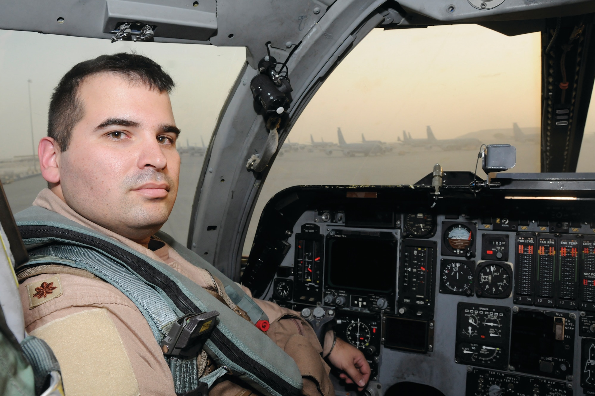Maj. Eric Moraes, B-1B Lancer pilot for the 379th Air Expeditionary Wing, sits in the cockpit of his aircraft. Major Moraes was recently reunited with his brother at 20,000 feet over Afghanistan during a combat sortie Sept. 10. His brother, Capt. Jason Moraes, 380 AEW, flew the KC-10 Extender aircraft that refueled the B-1B. The brothers had been apart for a year when they met in the skies above the AOR for the 10-minute reunion. (U.S. Air Force photo by Staff Sgt. Darnell Cannady)