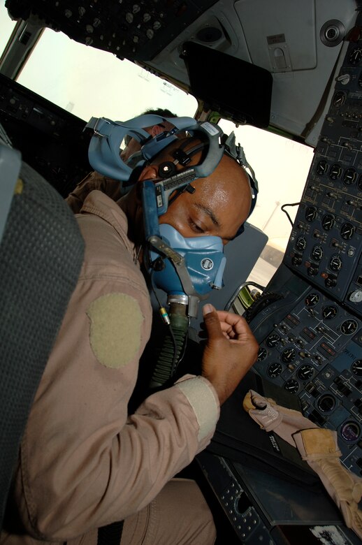 SOUTHWEST ASIA -- Staff Sgt. Nate Livingston from the 908th Expeditionary Air Refueling Squadron test his oxygen mask during preflight checks here Sept. 16. The 908th EARS fly numerous refueling sorties in direct support of the war on terrorism in Southwest Asia. Sergeant Livingston is deployed from the 32nd ARS, McGuire Air Force Base, N.J. His hometown is Gardena, Calif. (U.S. Air Force photo/Tech. Sgt. Christopher A. Campbell)(released)