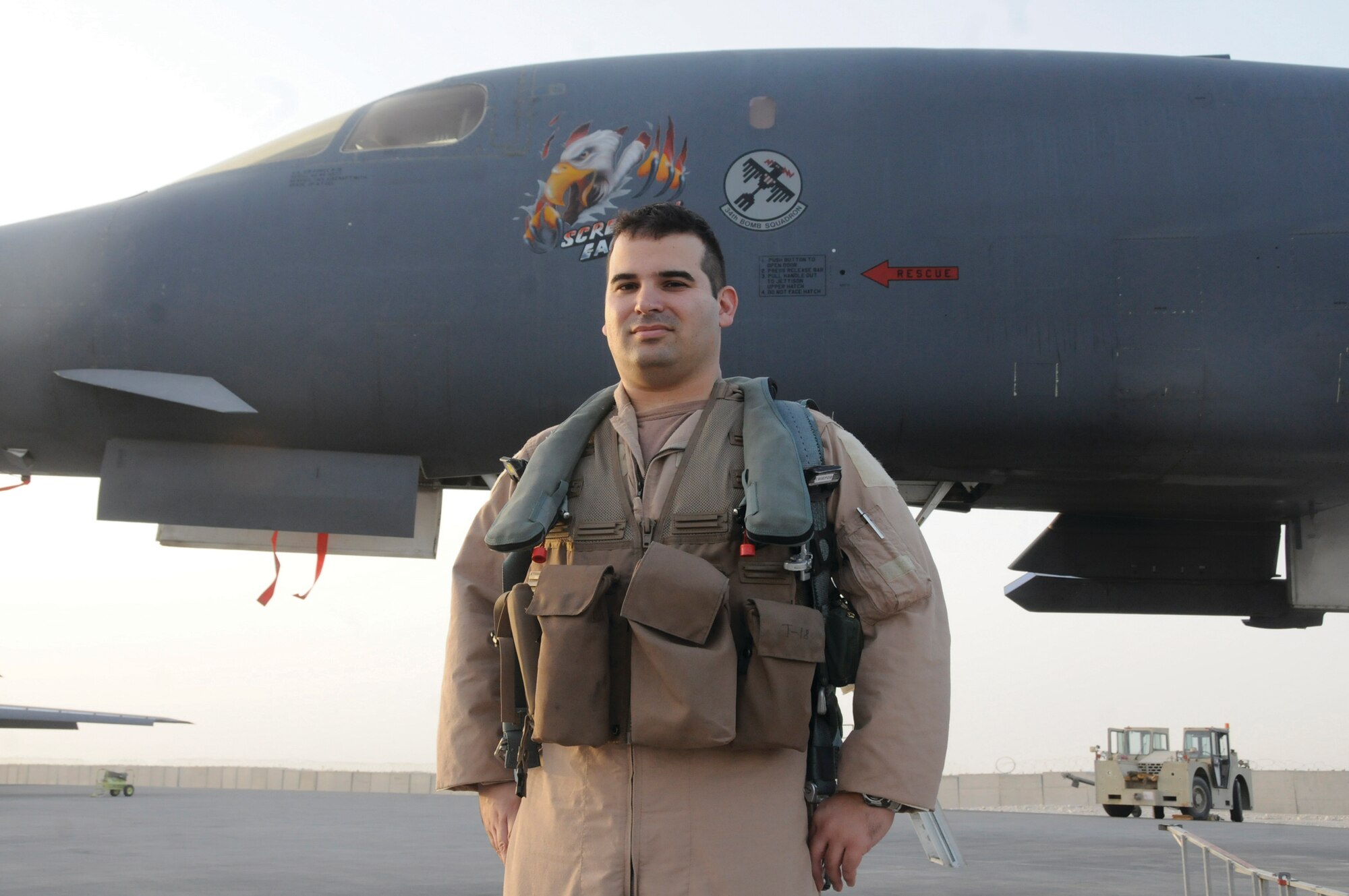 Maj. Eric Moraes, B-1B Lancer pilot for the 379th Air Expeditionary Wing, stands in front of his aircraft. Major Moraes was recently reunited with his brother 20,000 feet over Afghanistan during a combat sortie Sept. 10. His brother, Capt. Jason Moraes, 380 AEW, flew the KC-10 Extender aircraft that refueled the B-1B. The brothers had been apart for a year when they met in the skies above the AOR for the 10-minute reunion. (U.S. Air Force photo by Staff Sgt. Darnell Cannady)