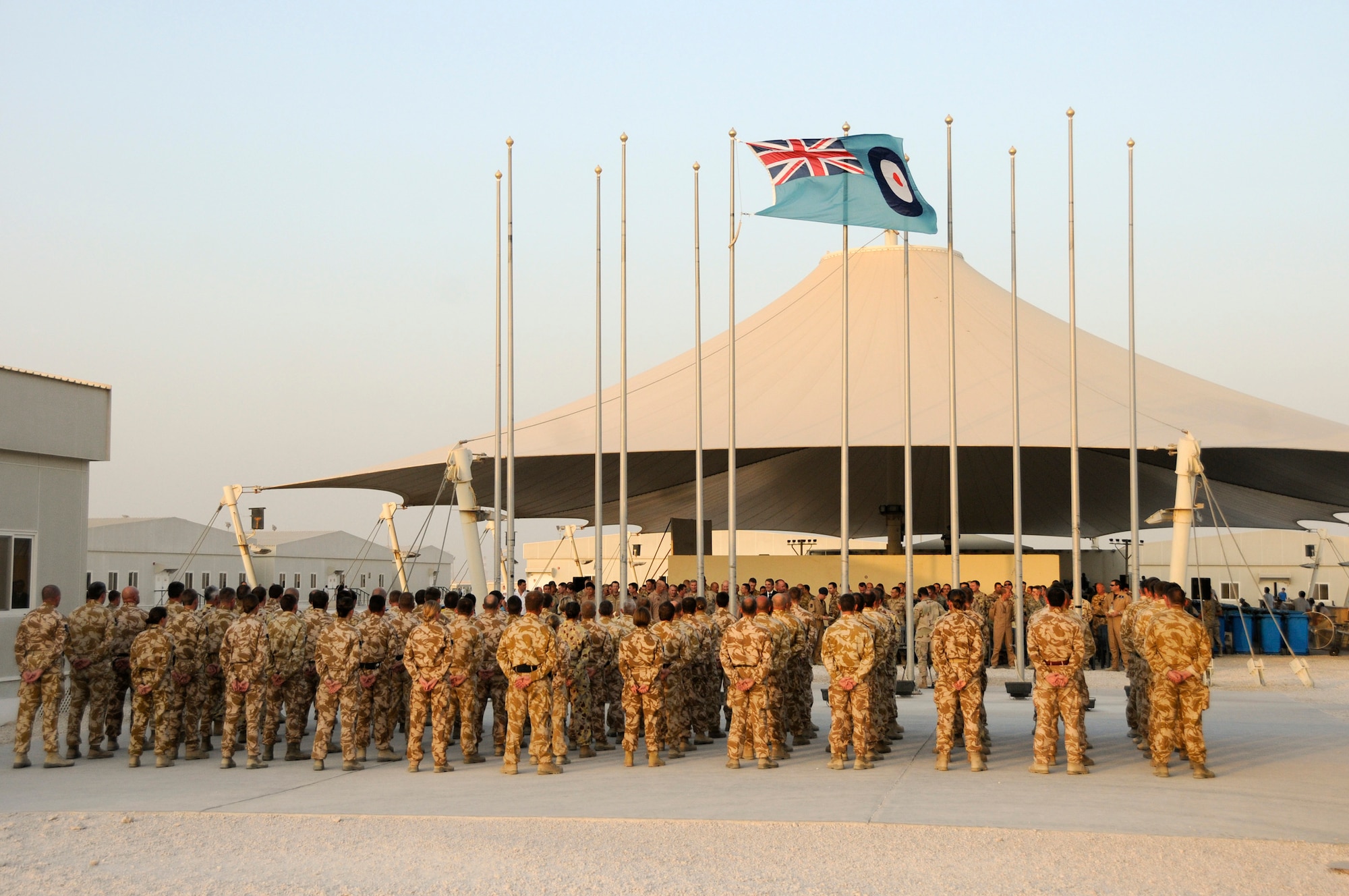 A flight of Royal Air Force and Royal Australian Air Force personnel stand in formation prior to the start of the Battle of Britain Sunset Ceremony here Sept. 15. The sunset ceremony recognized the Battle of Britain in which the Allied Forces were out numbered four to one and were victorious.  (U.S. Air Force photo By Tech. Sgt. Michael Boquette)
