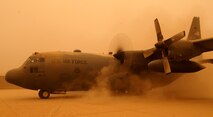 A C-130 Hercules starts up one of its four engines Sept. 15 at Joint Base Balad, Iraq, kicking up a cloud of sand. The C-130 is deployed to the 777th Expeditionary Airlift Squadron here from Little Rock Air Force Base, Ark. (U.S. Air Force photo/Tech. Sgt. Erik Gudmundson)