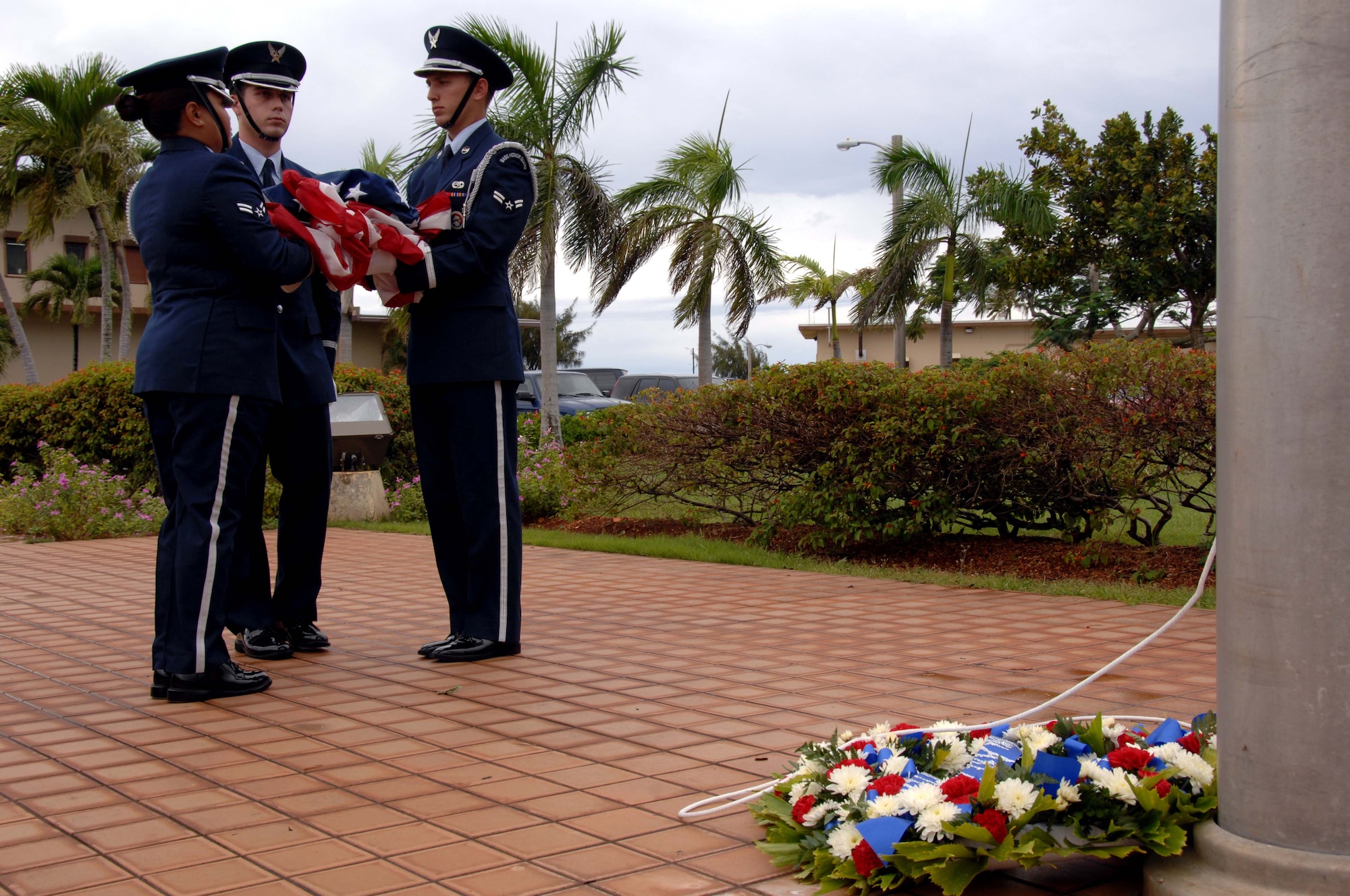ANDERSEN AIR FORCE BASE, Guam - Team Andersen honor guard members prepare to fold the flag during retreat ceremony here Sept. 19. The ceremony was held in observance of POW/MIA day. (U.S. Air Force photo by Airman 1st Class Nichelle Griffiths)
