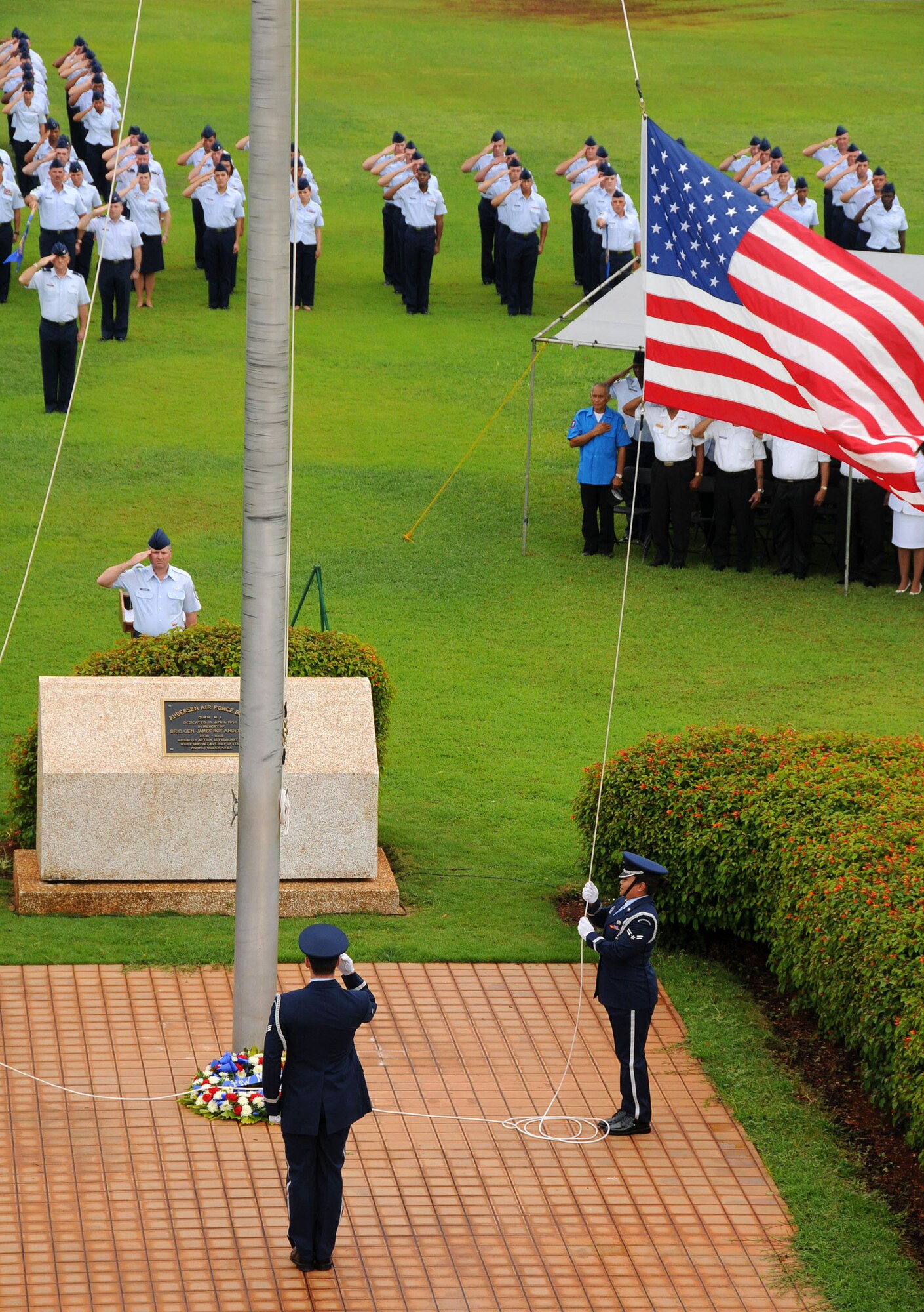ANDERSEN AIR FORCE BASE, Guam -- Team Andersen honor guard members lower the flag as "Retreat" plays during the POW/MIA Retreat Ceremony here Sept. 19. This year's retreat kicked off with a 24-hour run at Arc Light Memorial Park. (U.S. Air Force photo by Airman 1st Class Courtney Witt)