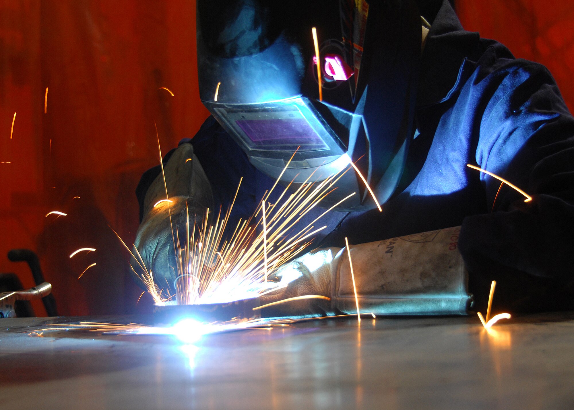 SOUTHWEST ASIA -- Senior Airman Timothy Jeffers, 386th Expeditionary Maintenance Squadron Combat Metals section, welds pieces of a fuel probe mounting bracket together for a C-130 Hercules on Sep. 17 at an air base in Southwest Asia. The Combat Metals shop performs aircraft sheet metal fabrication, structural repairs and modifications for aircraft. Airman Jeffers is deployed from Davis-Monthan Air Force Base, Ariz. (U.S. Air Force photo/Tech. Sgt. Raheem Moore)