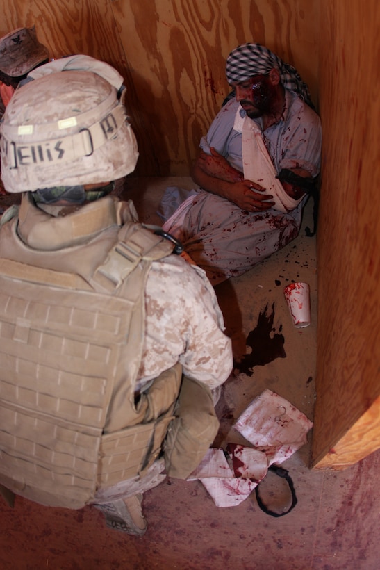 Marines with 3rd Battalion, 8th Marine Regiment treat casualties from at mock explosion during a first responder drill in a mock Afghan town at Range 215 as part of an Afghanistan-centered Mojave Viper at the Combat Center Sept. 20.